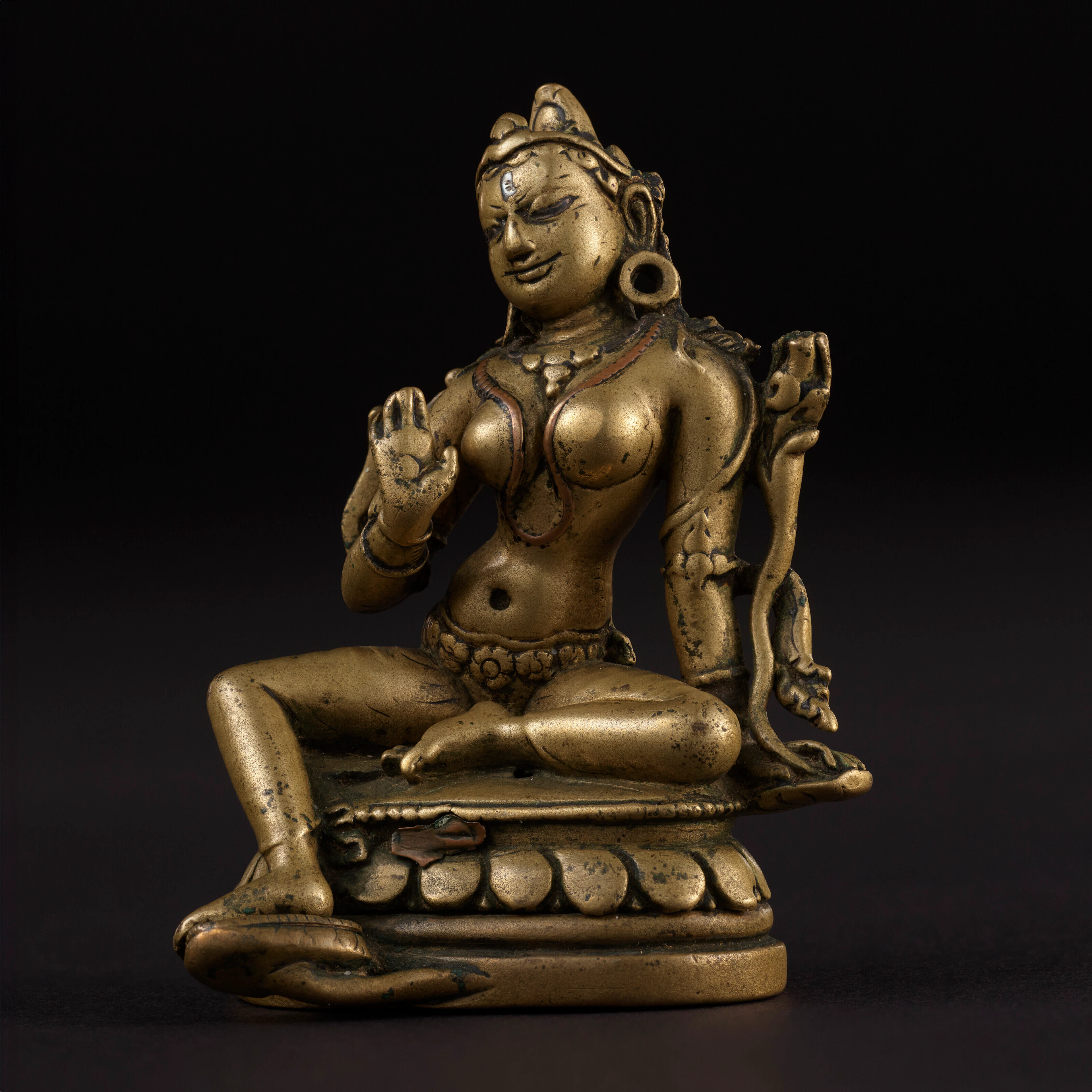 A SILVER AND COPPER INLAID BRASS FIGURE OF TARA