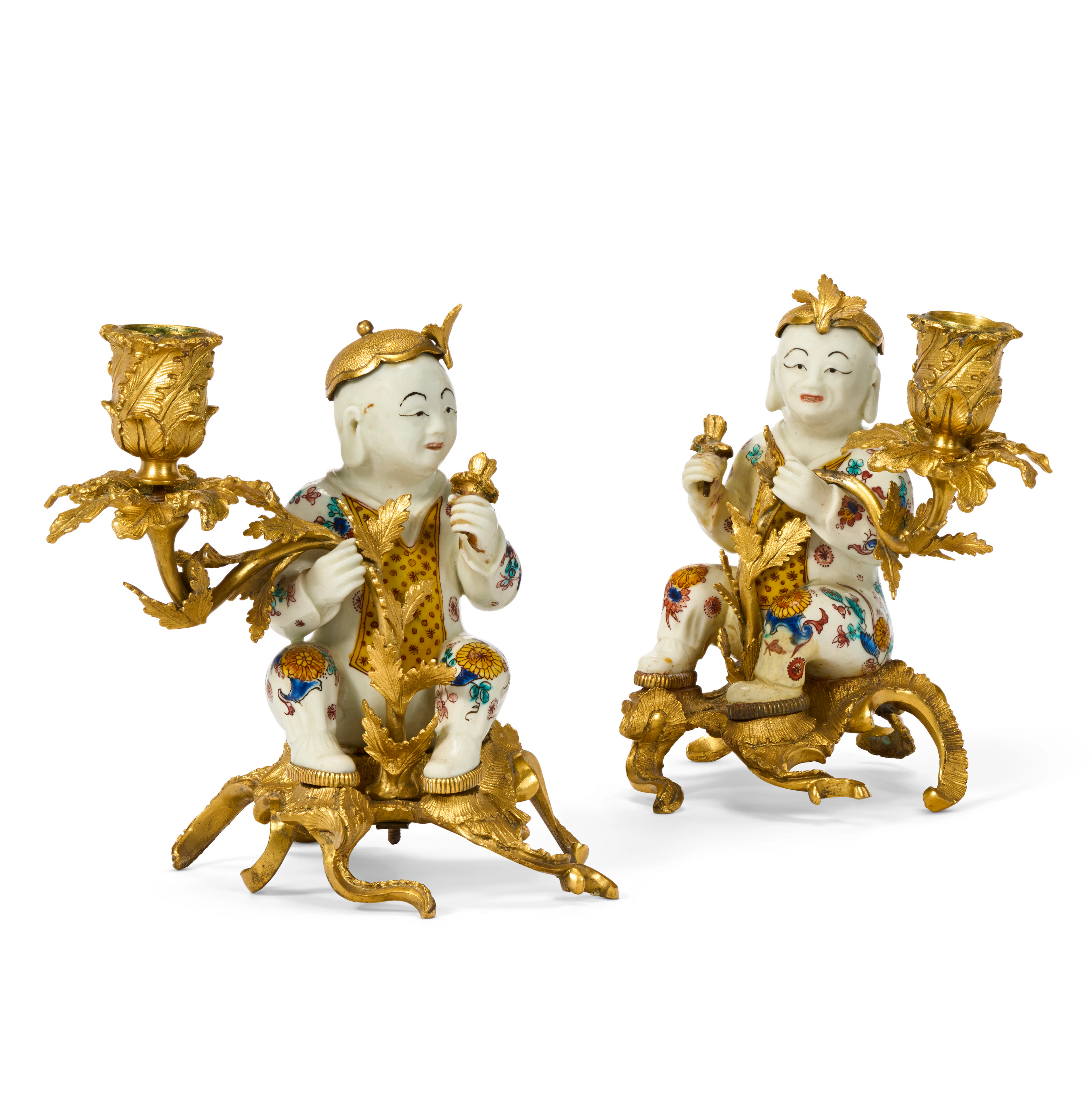 A PAIR OF LOUIS XV ORMOLU-MOUNTED MENNECY PORCELAIN CANDLESTICKS