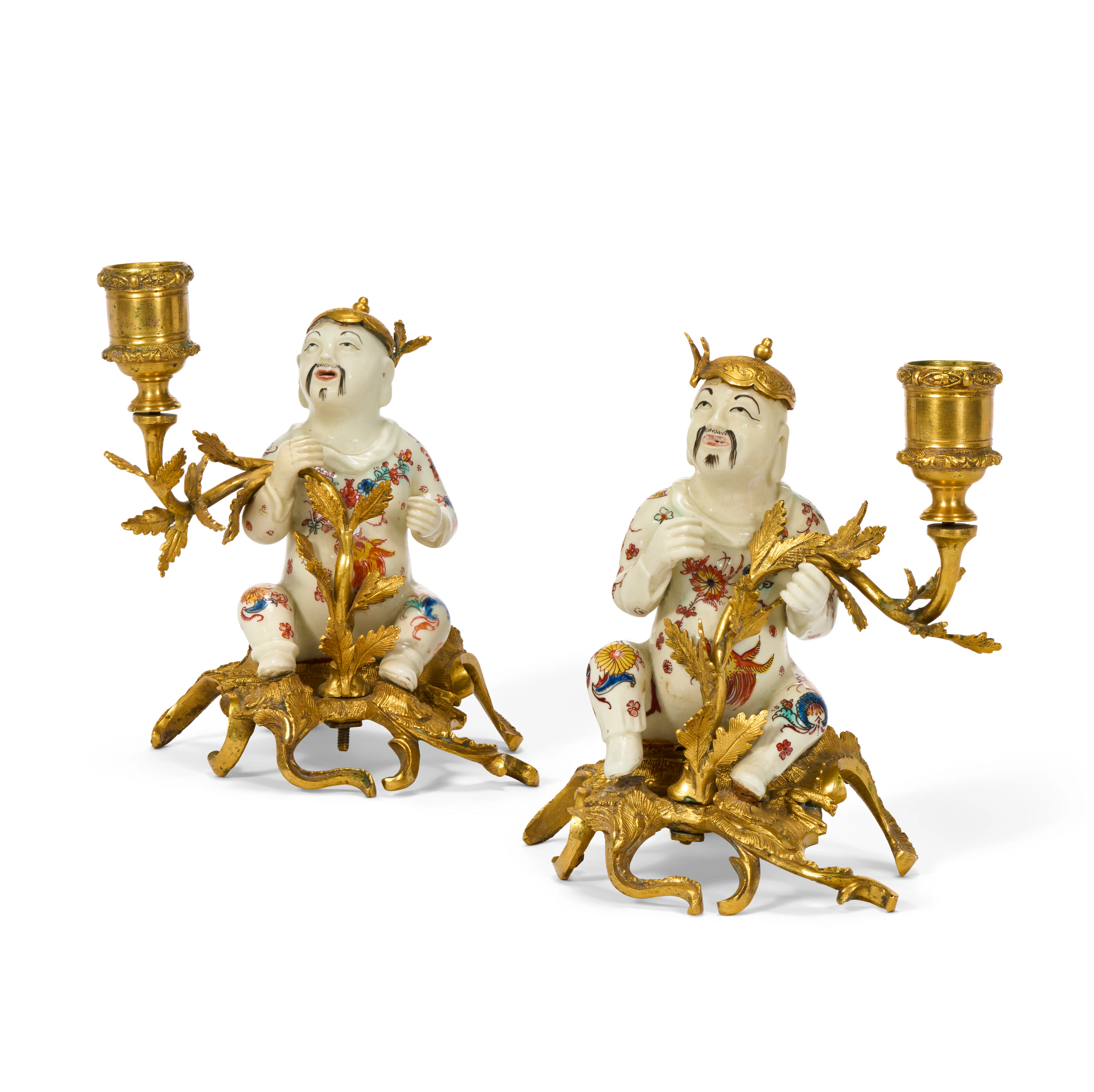 A PAIR OF LOUIS XV ORMOLU-MOUNTED MENNECY PORCELAIN CANDLESTICKS