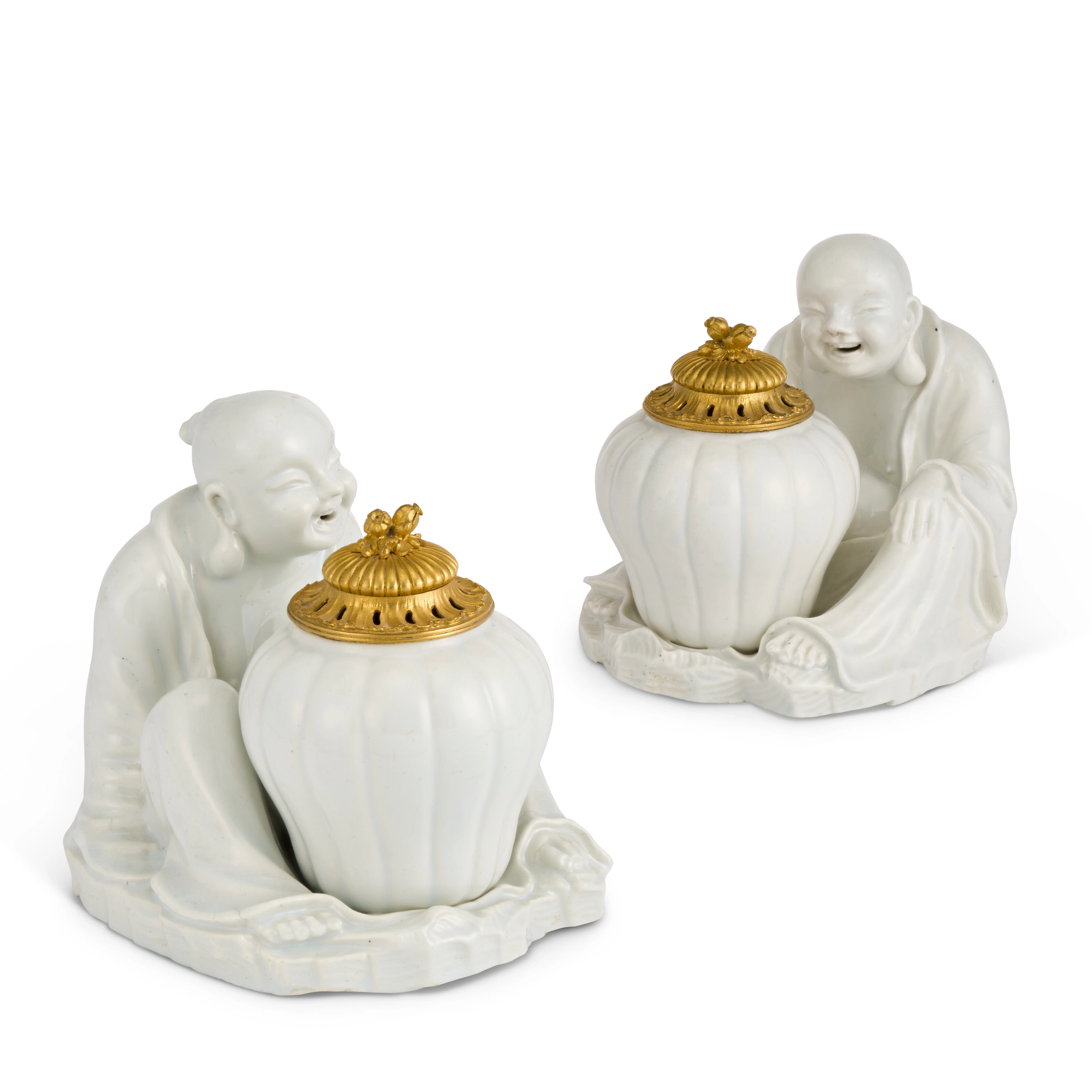 A PAIR OF ORMOLU-MOUNTED CHANTILLY PORCELAIN MODELS OF SEATED MAGOTS