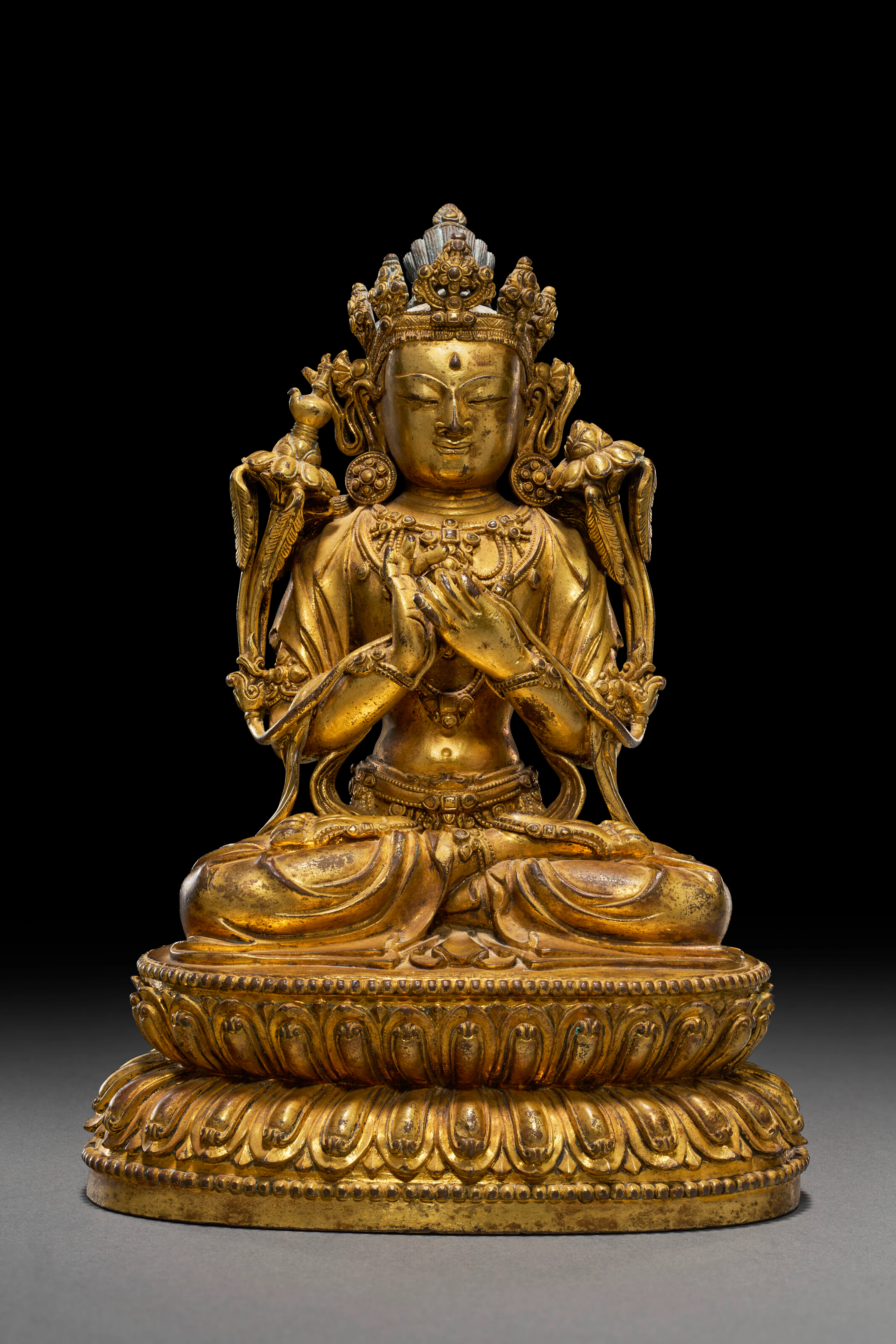 A GILT-BRONZE FIGURE OF MAITREYA