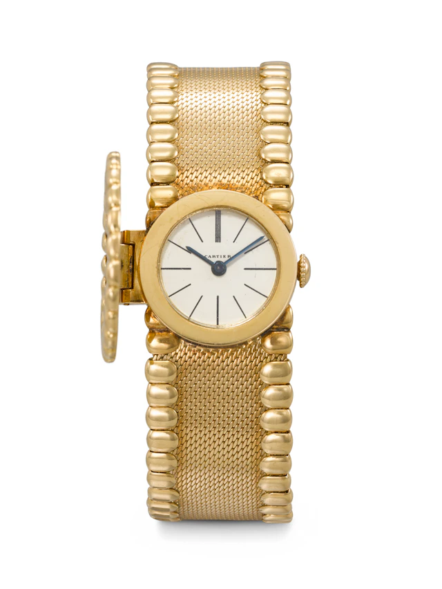Cartier. A Very Rare and Elegant 18K Gold Bracelet Watch with Concealed Dial