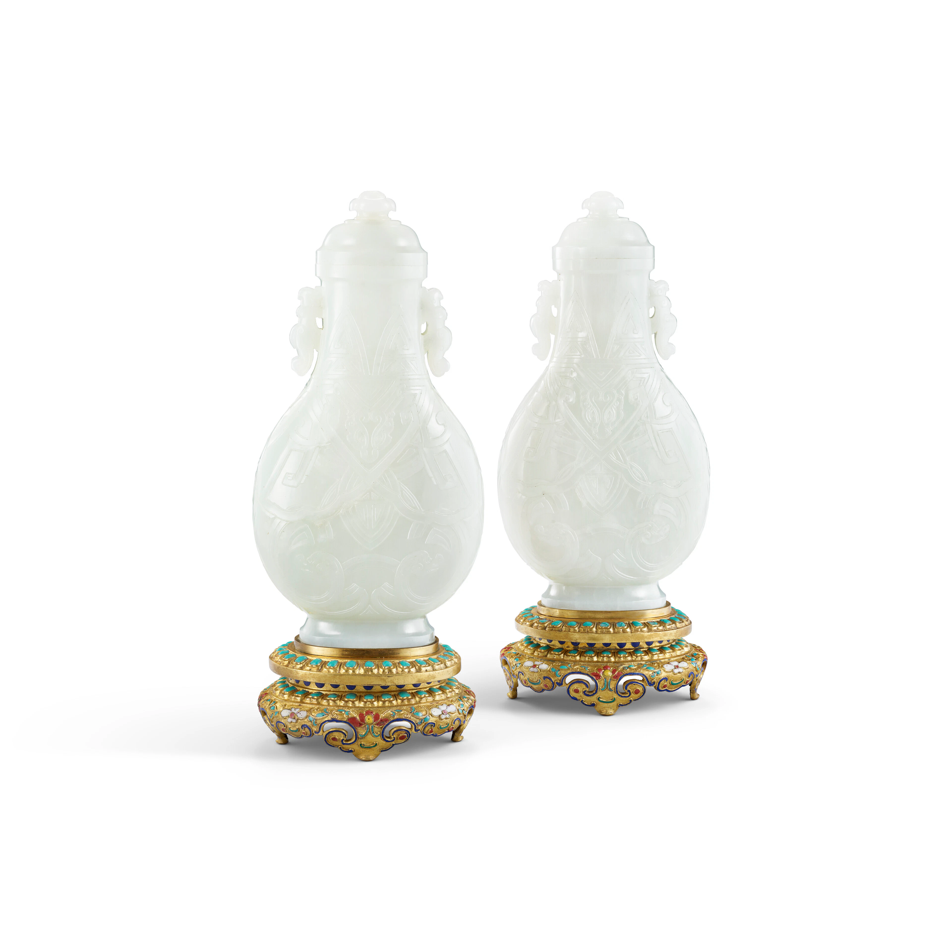 A Very Rare and Superb Pair of Archaistic White Jade 'Dragon' Vases and Covers