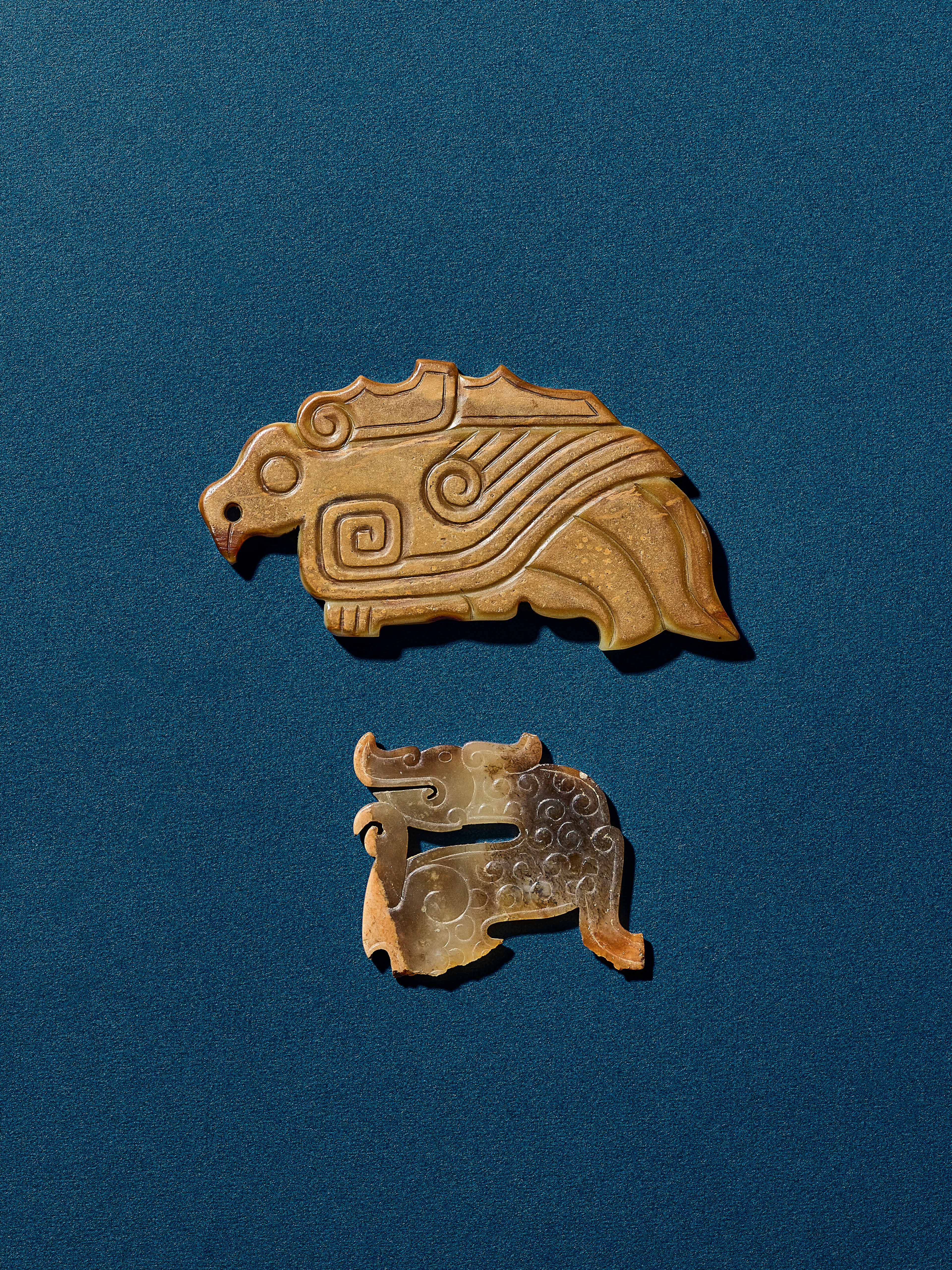 A Jade Fragment of 'Dragon' Pendant and a Jade 'Bird' Pendant