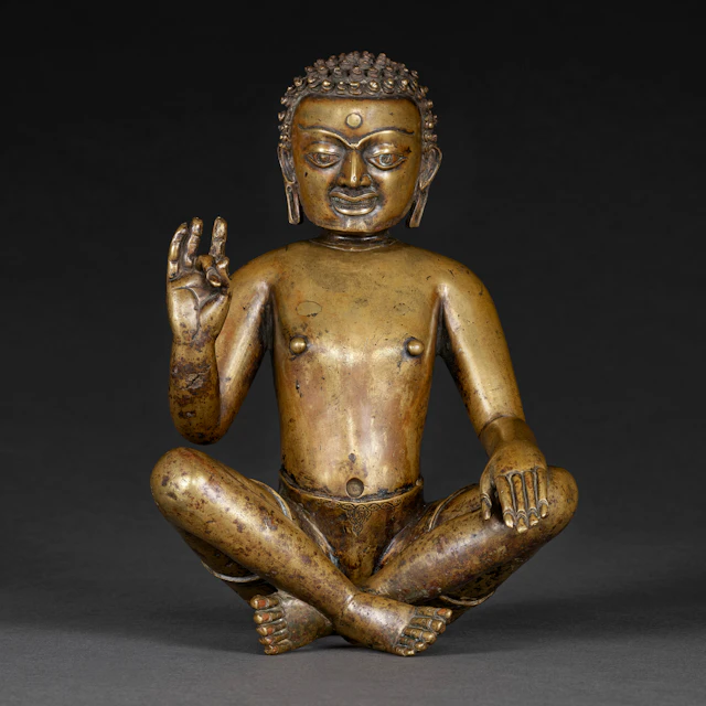 A COPPER INLAID BRASS FIGURE OF A YOGI, PROBABLY PADAMPA SANGYE