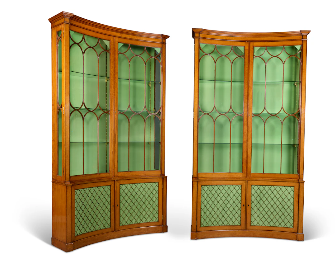 A Pair of George Iii Satinwood Concave Bookcases