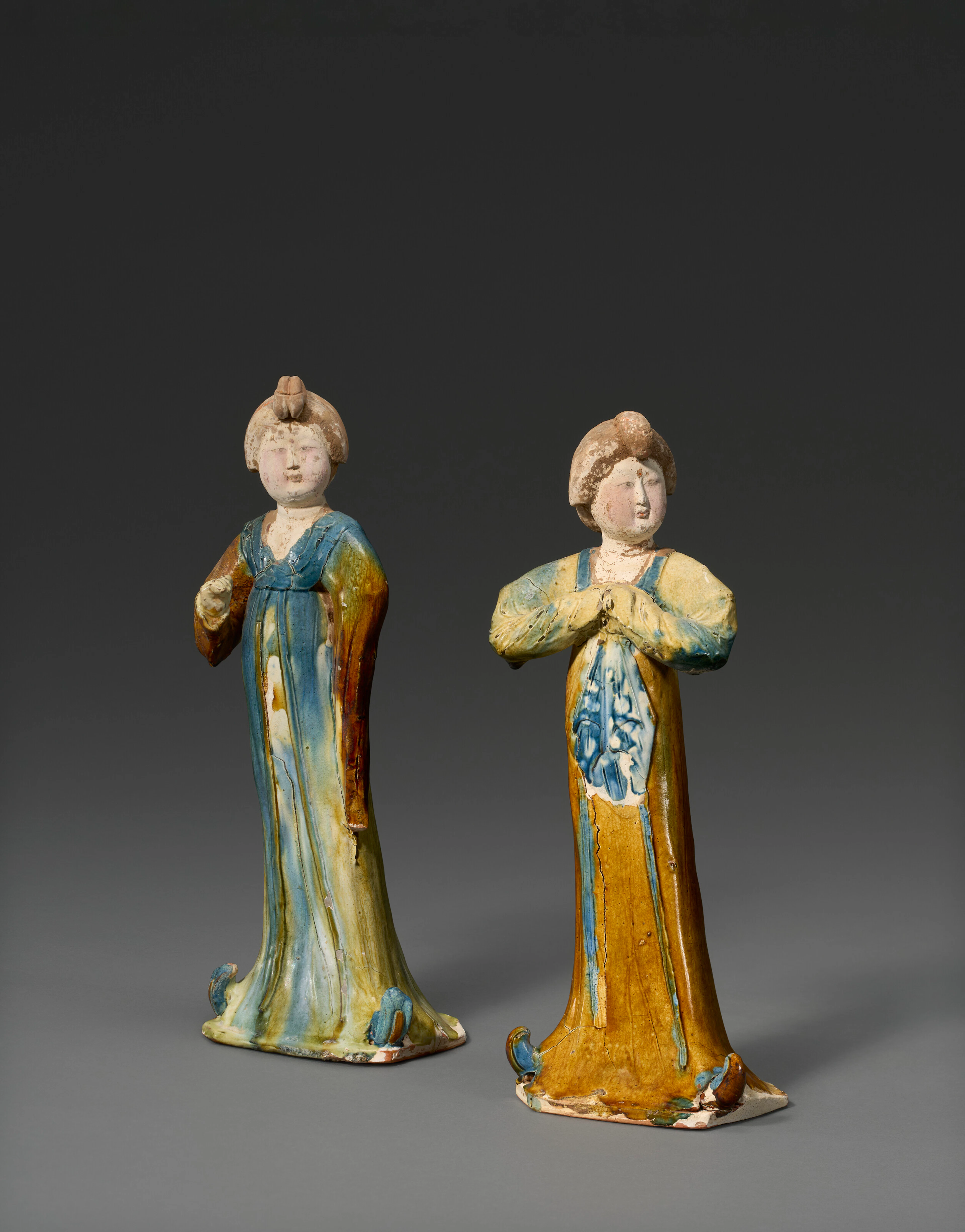 Two Painted, Blue-Splashed and Sancai -Glazed Pottery Figures of Court Ladies