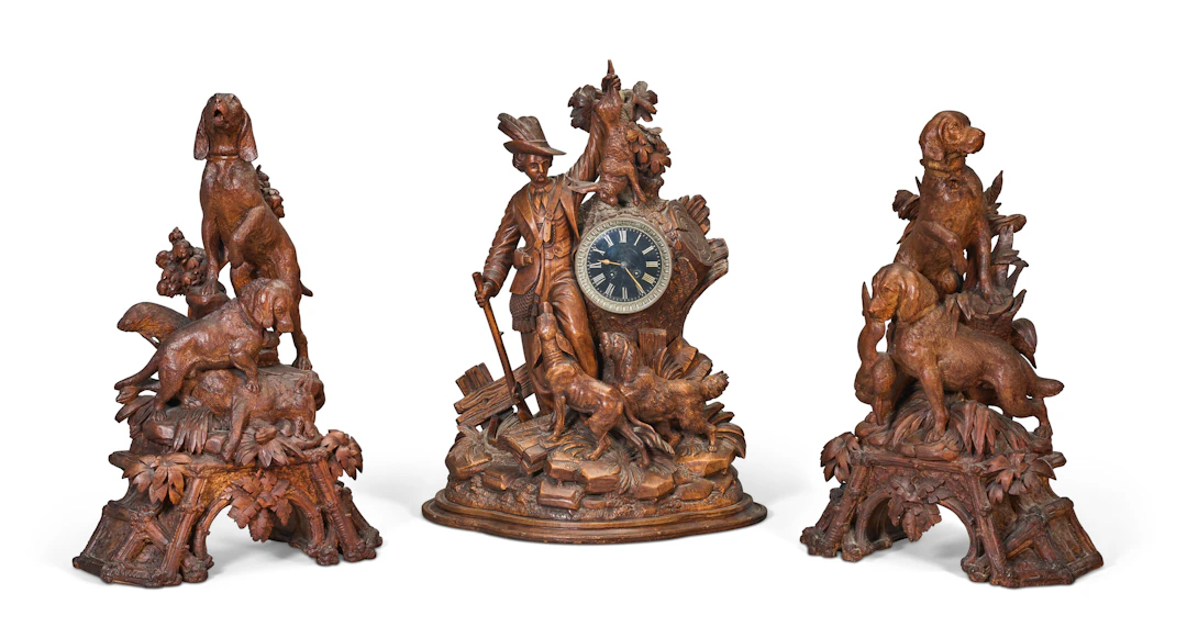 An Assembled Swiss 'Black Forest' Three-Piece Clock Garniture