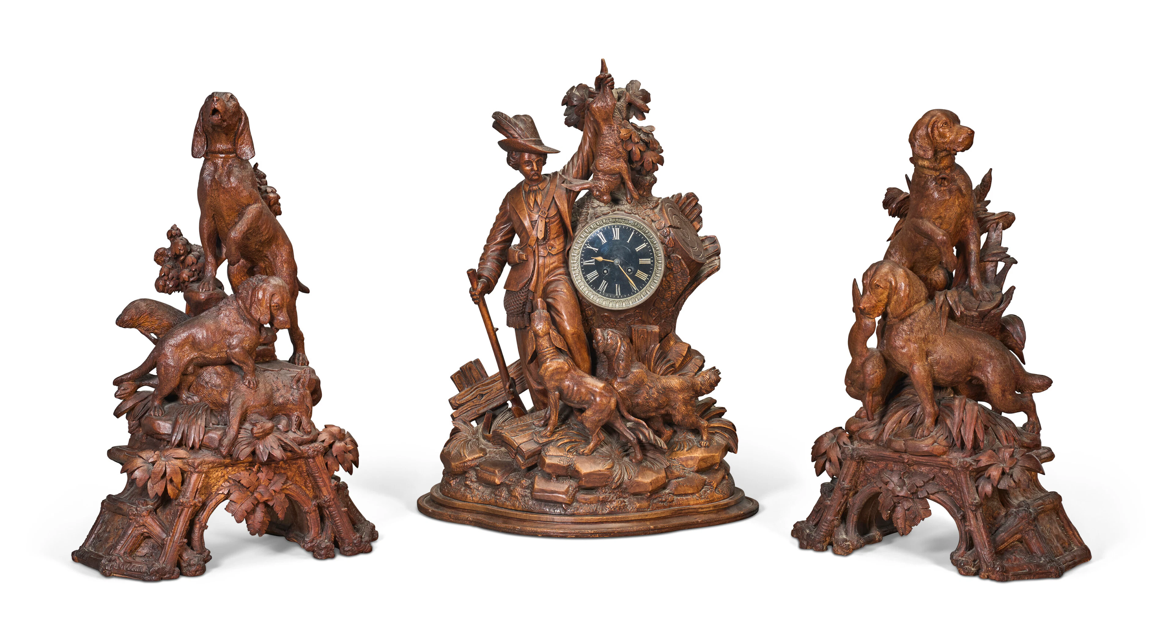 An Assembled Swiss 'Black Forest' Three-Piece Clock Garniture
