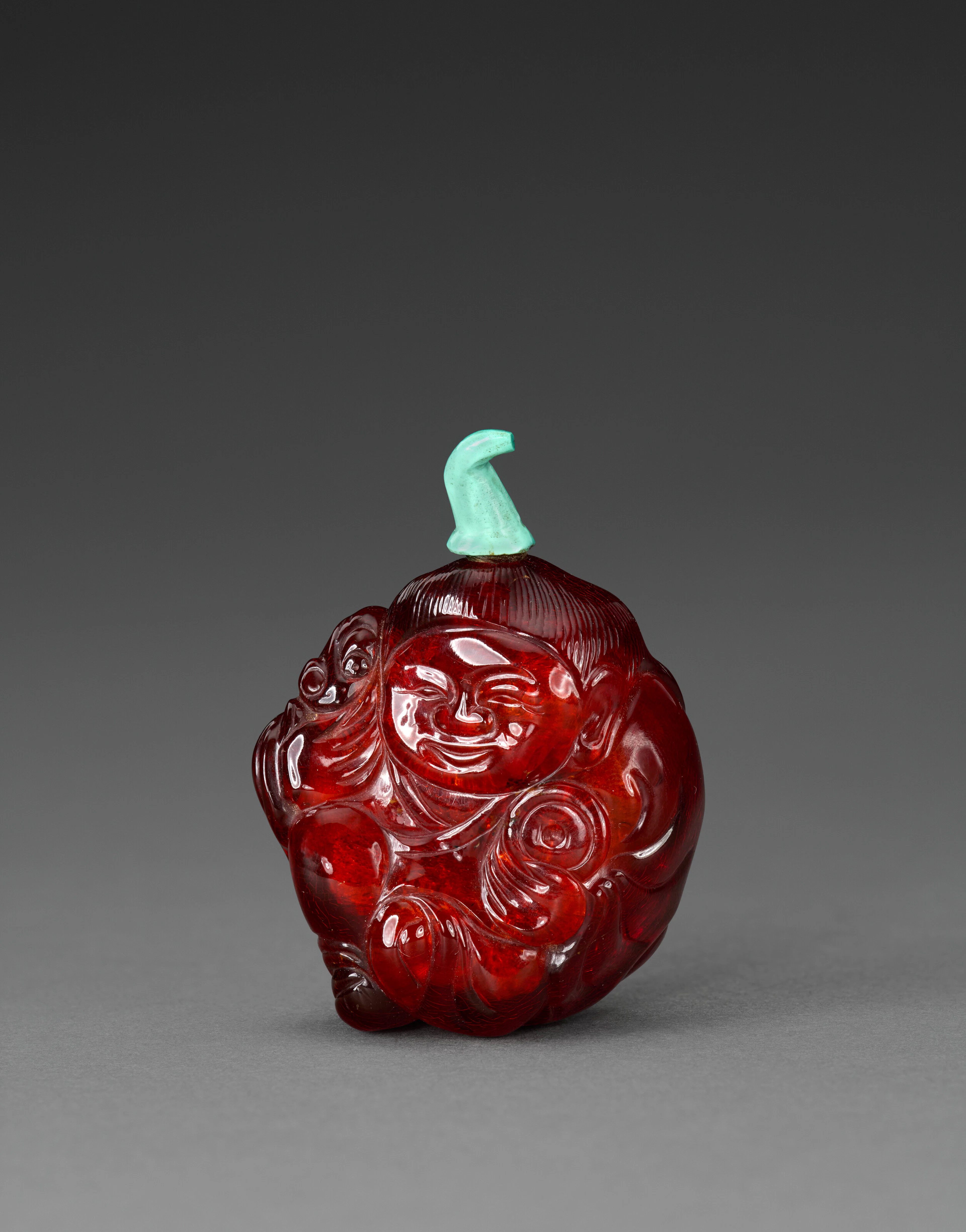 A Carved Amber 'Liu Hai and Toad' Snuff Bottle