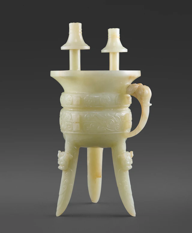 An Archaistic Pale Celadon Jade Tripod Vessel, Jia