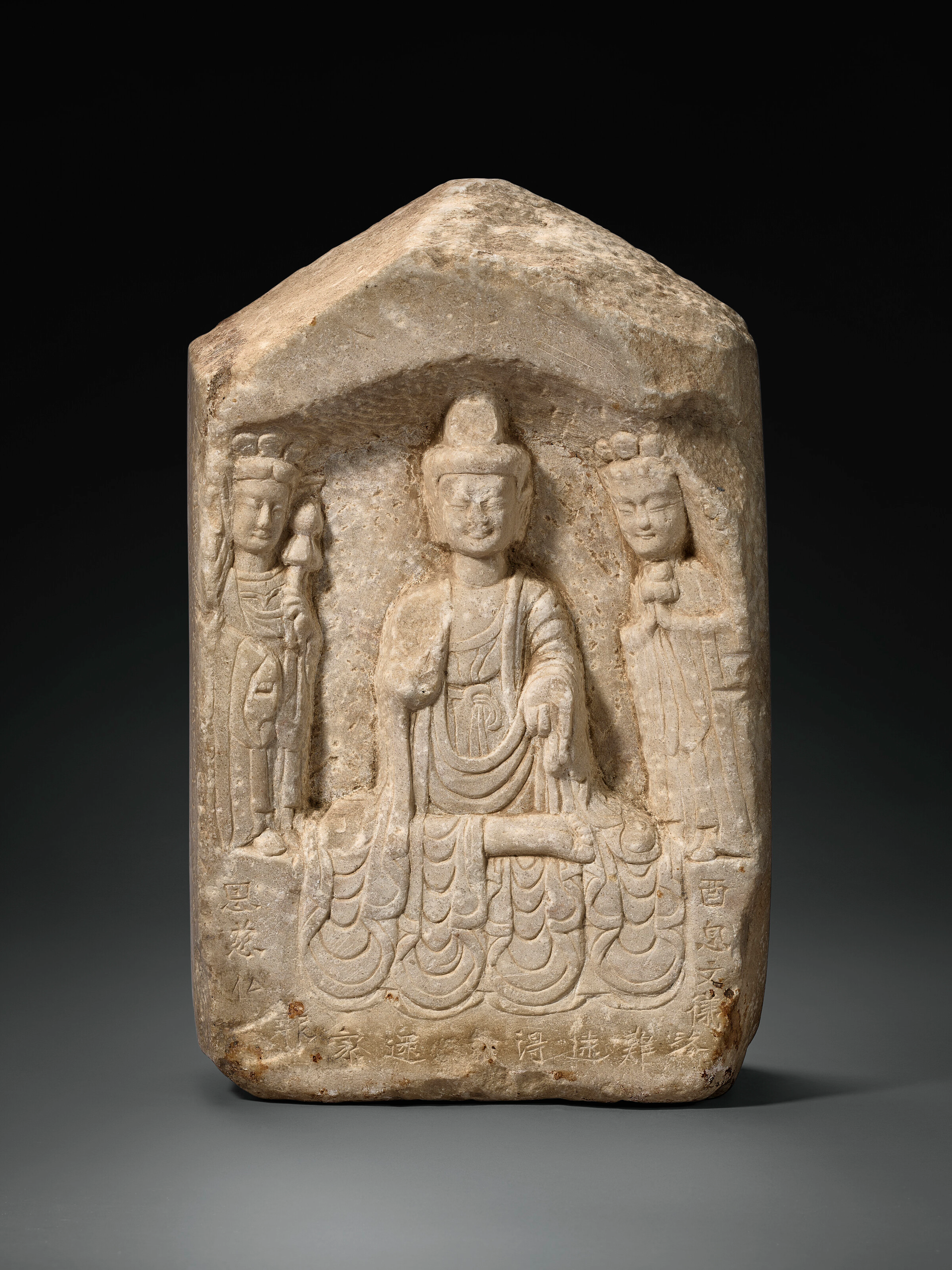 A WHITE MARBLE BUDDHIST STELE