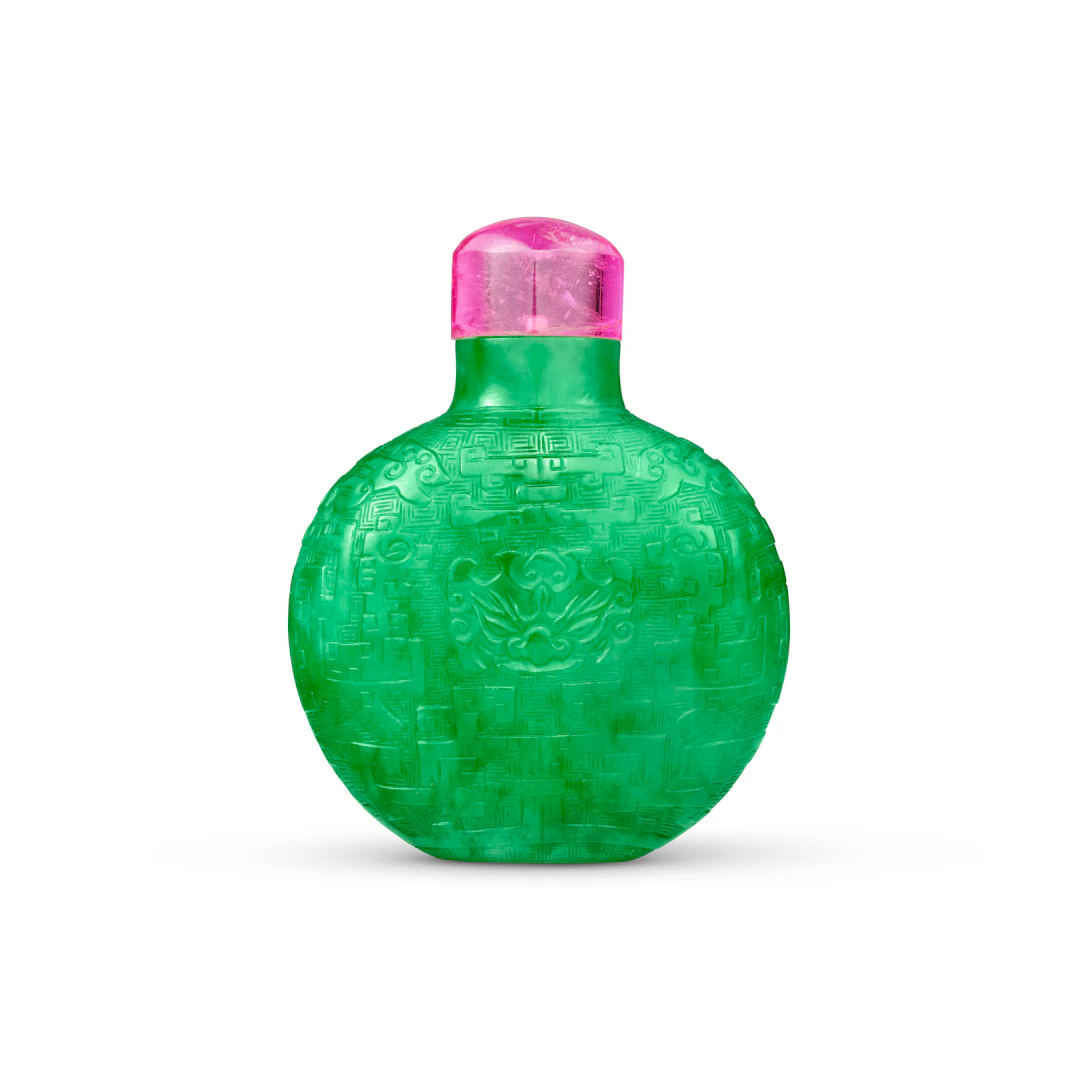 A Superb and Exceptionally Rare Carved Emerald-Green Jadeite 'Taotie'