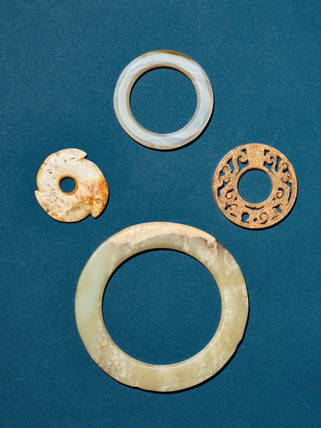 A Group of Three Jade Ornaments and an Agate Ornament