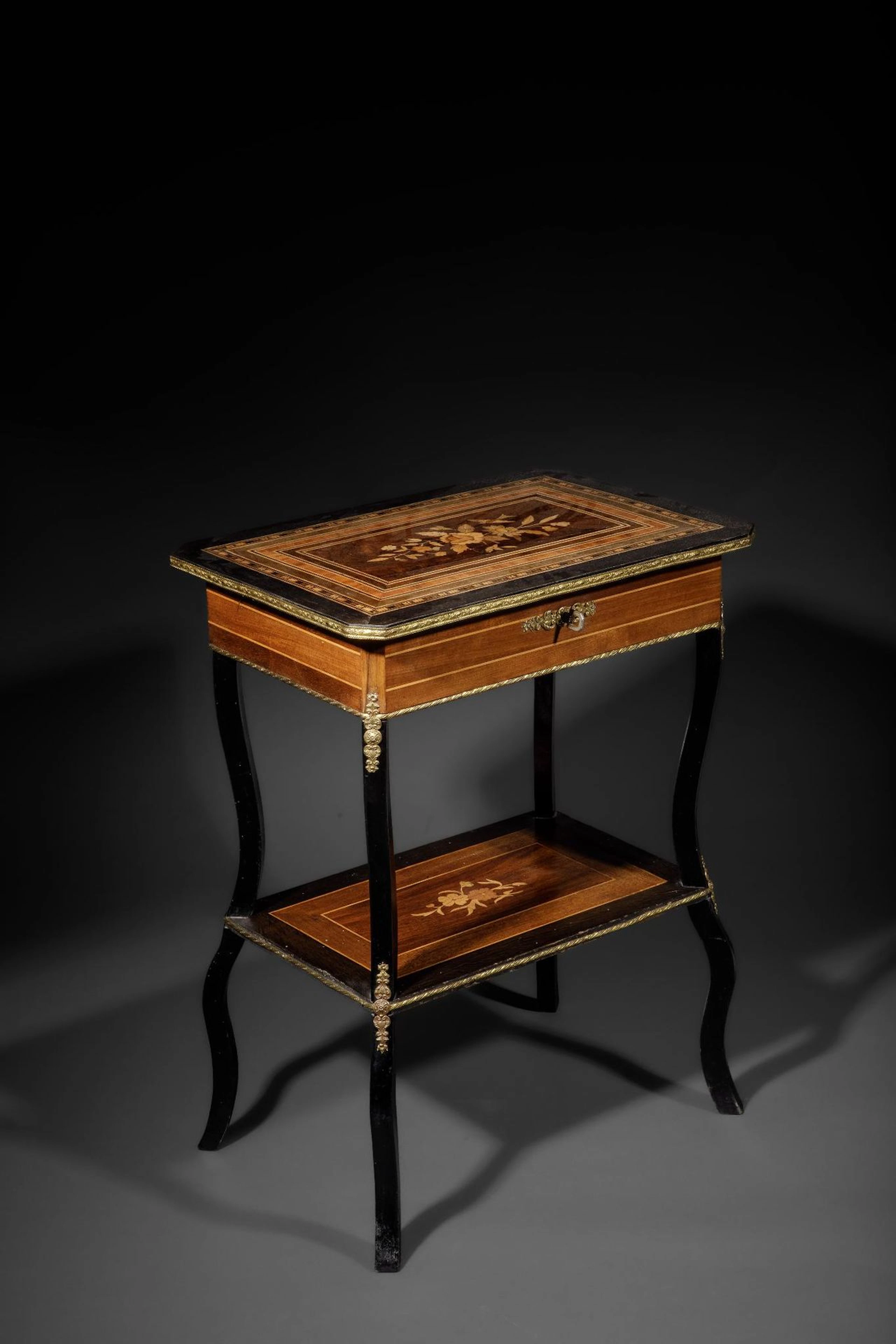 Crafted from mahogany, mahogany veneer, and blackened wood, - Lot 177