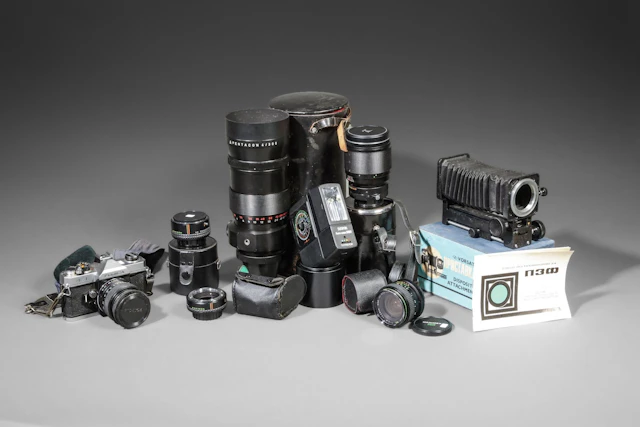 Set of three lenses and a Fujica camera - Lot 77