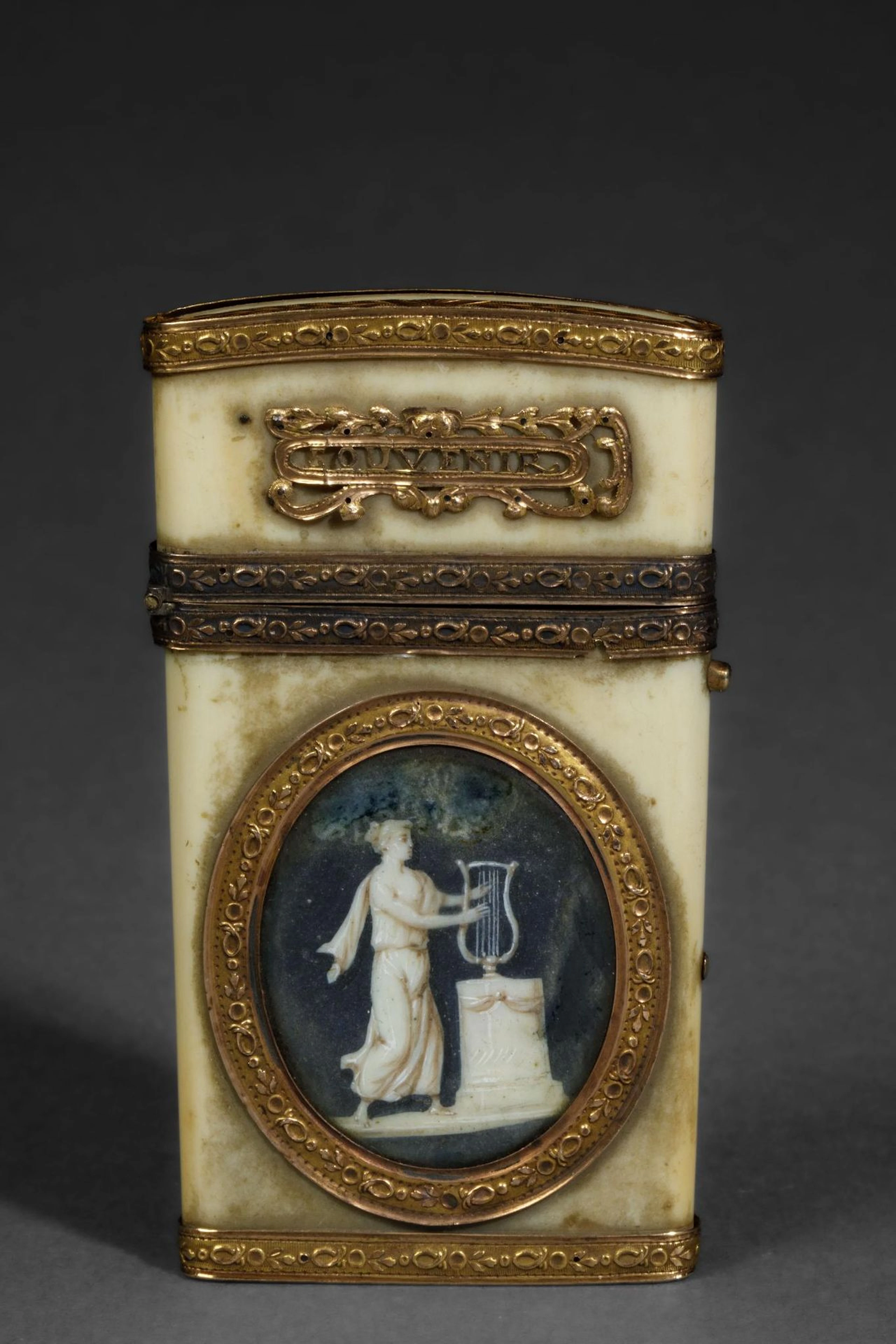 A dance card and its gold stylus in a bone case inscribed "S - Lot 135