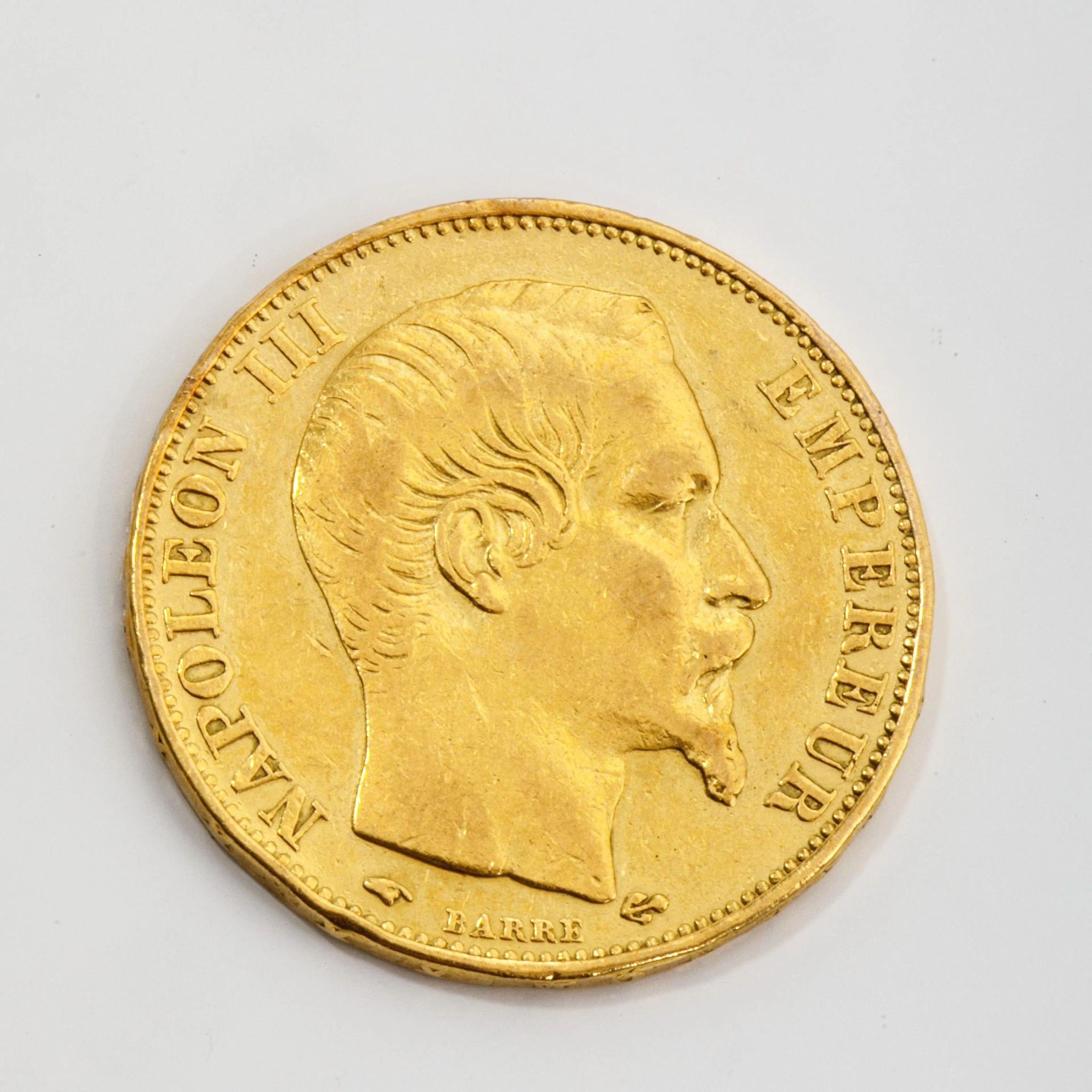 A 1859 Napoleon III 20-franc gold coin with a bare head. Wei - Lot 9