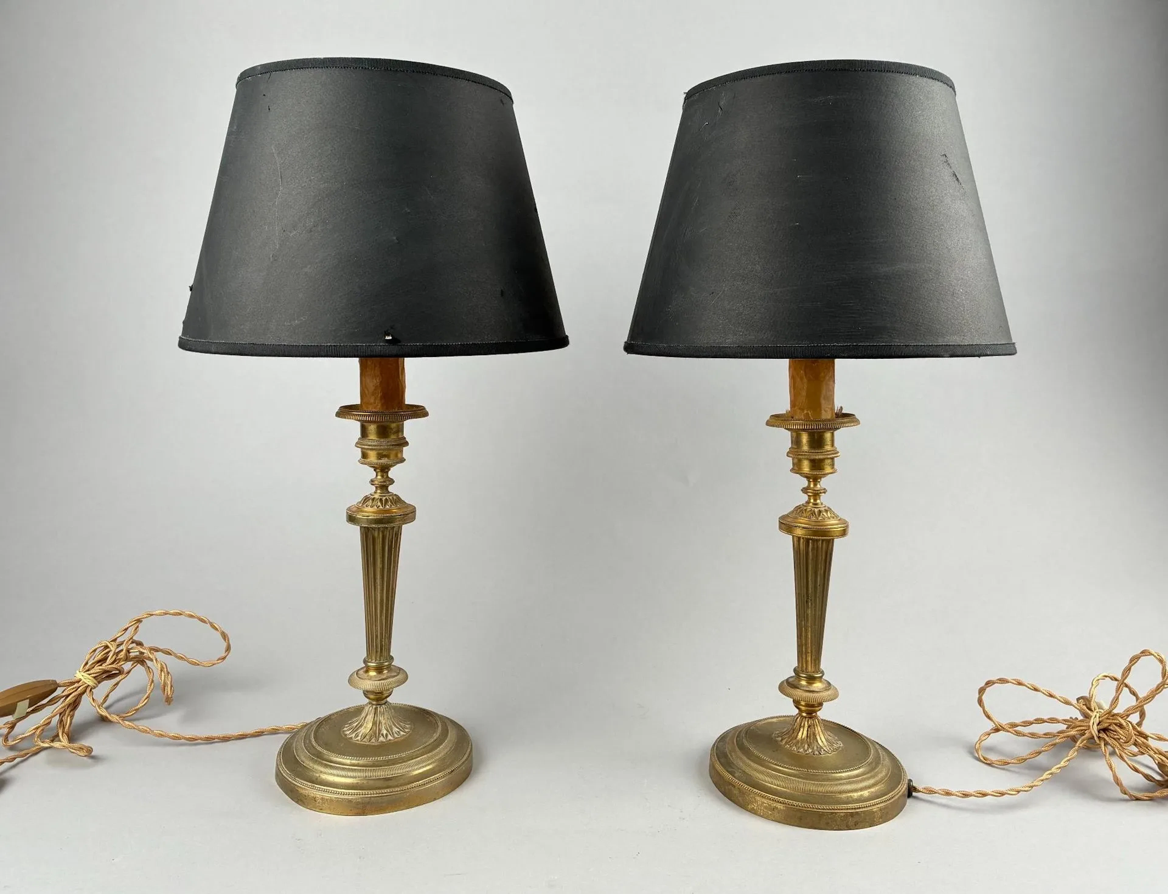 Two gilded bronze candlesticks with beaded circular bases an - Lot 56
