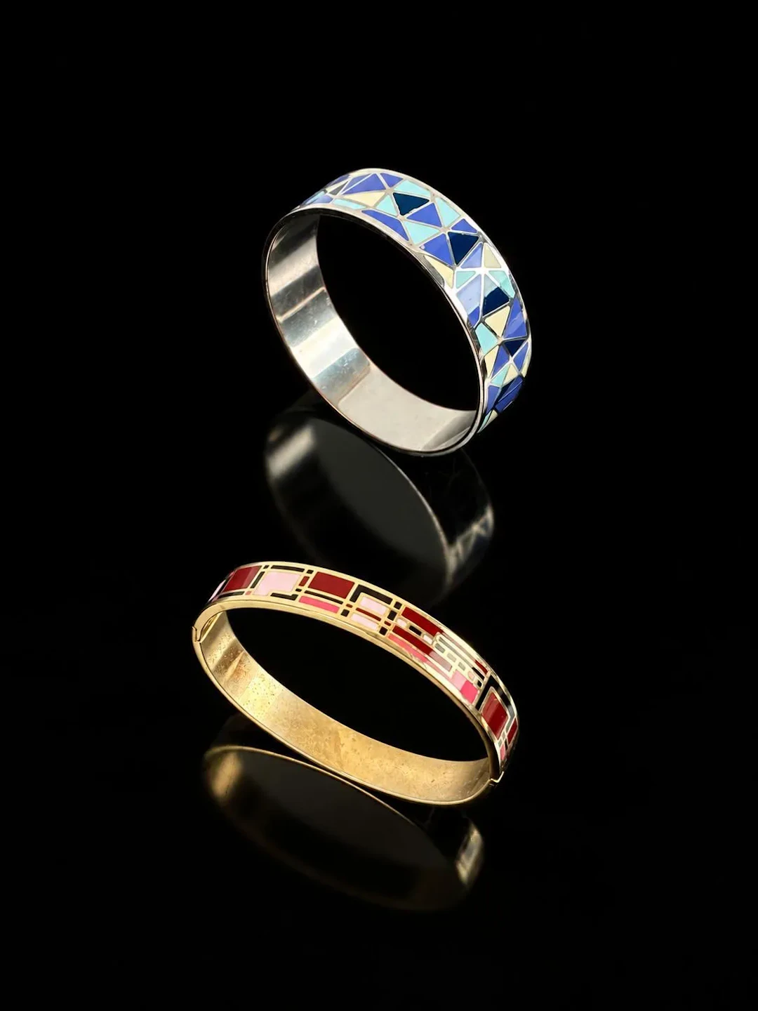 A set of two bangle bracelets: one is a gold-tone metal bang - Lot 195