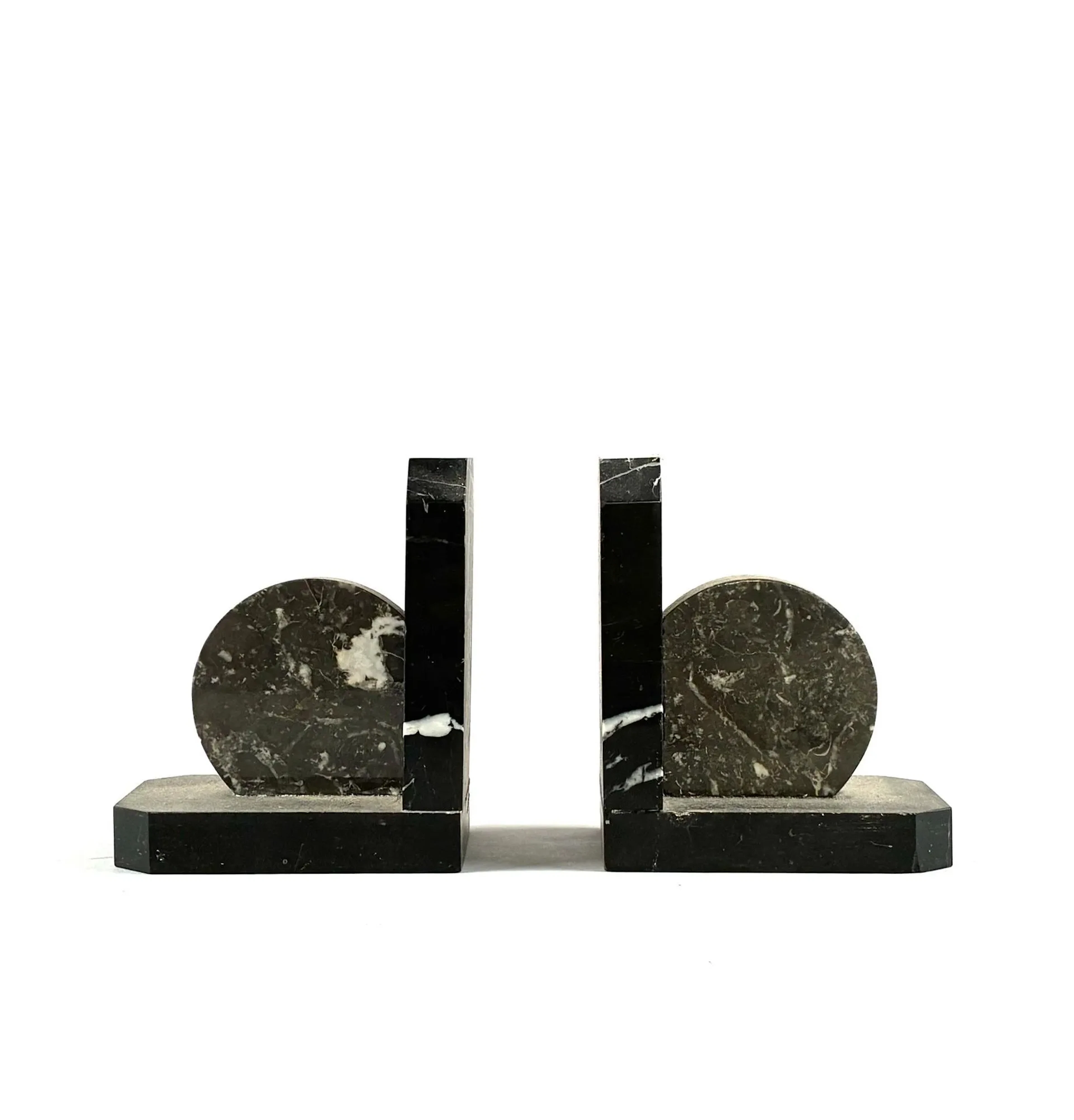 Pair of bookends made of black marble with white, gray, and - Lot 11
