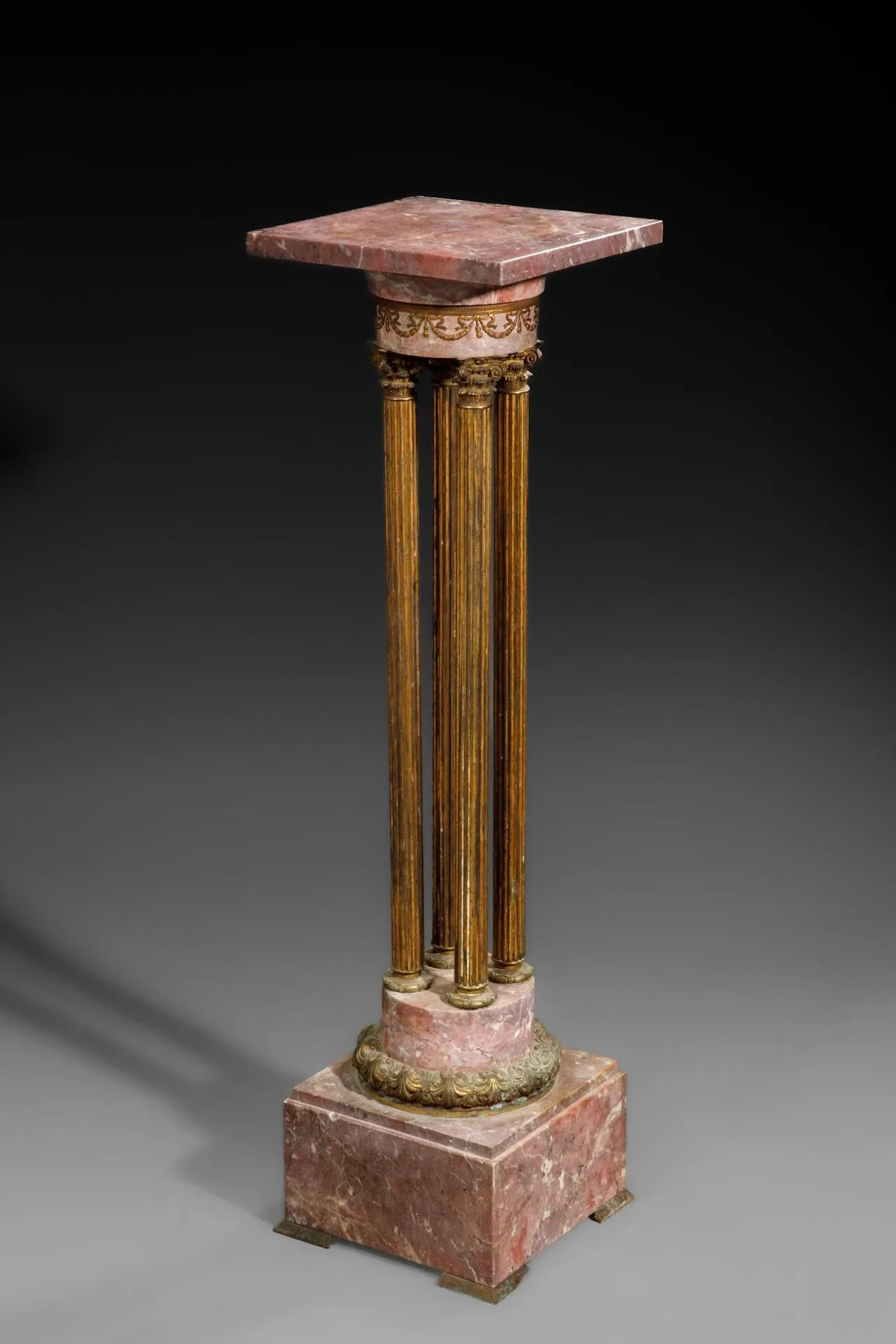 Pink marble and ormolu sellette with four detached fluted co - Lot 192
