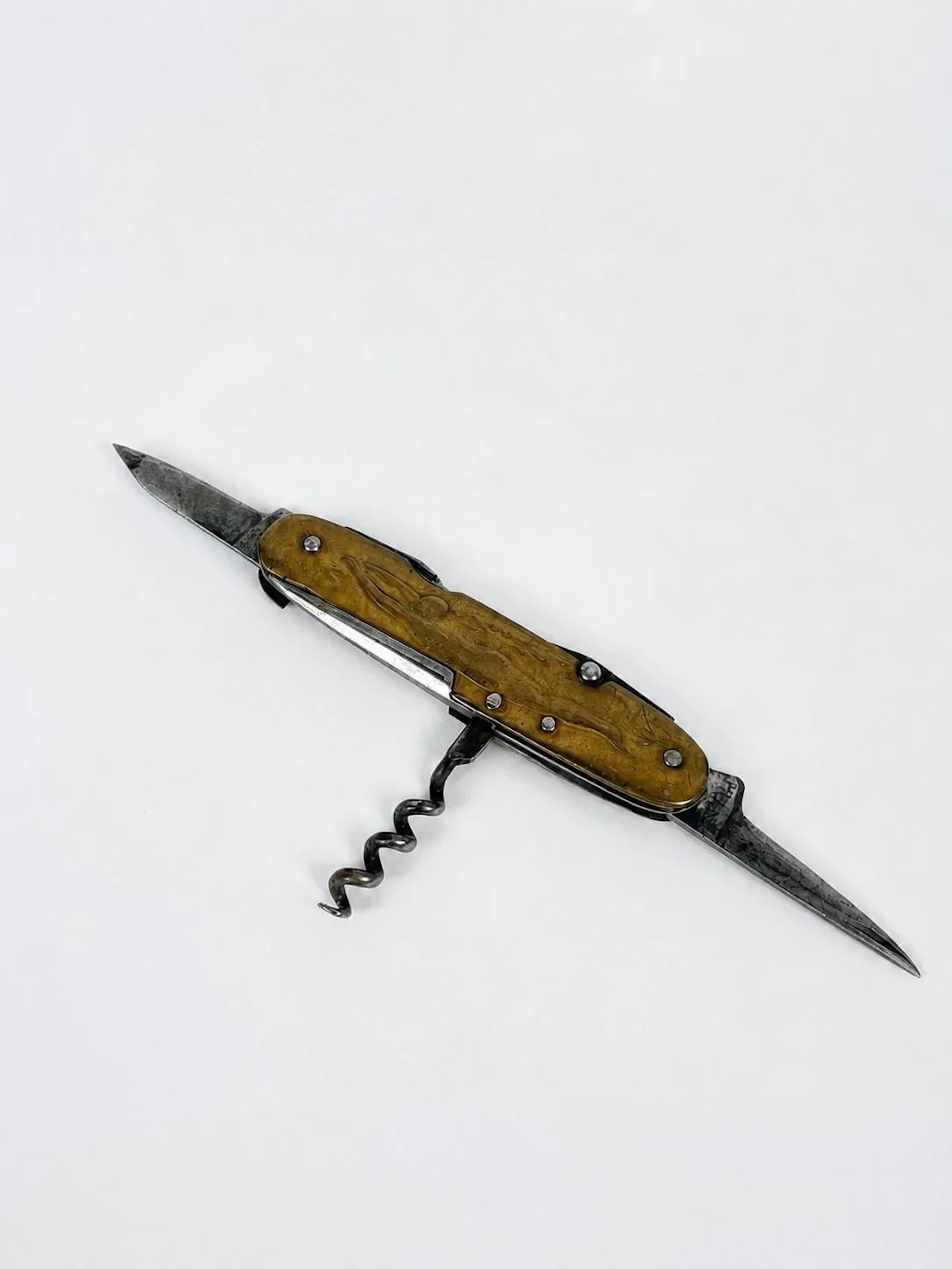 Swiss Army knife made of brass and steel, decorated on one s - Lot 429