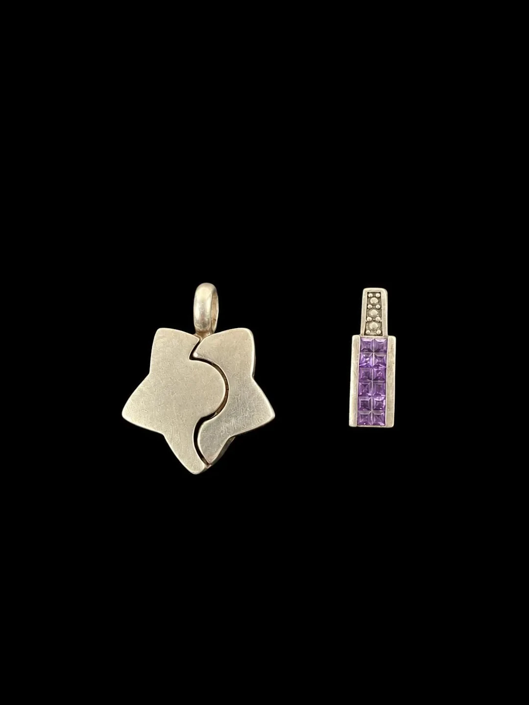 A set of two 925 sterling silver pendants—one shaped like a - Lot 136