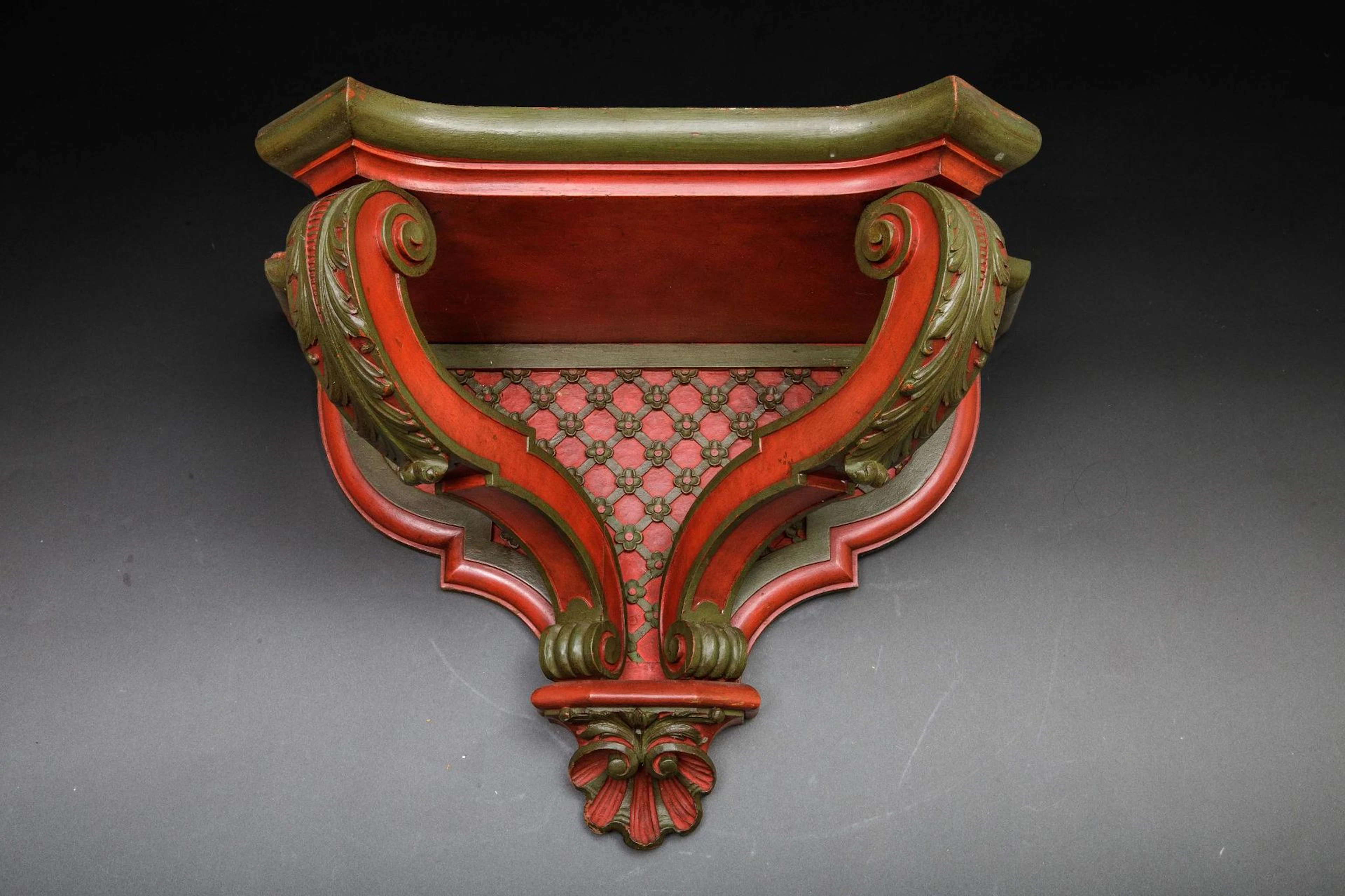 Small red-lacquered wooden console table featuring two styli - Lot 196
