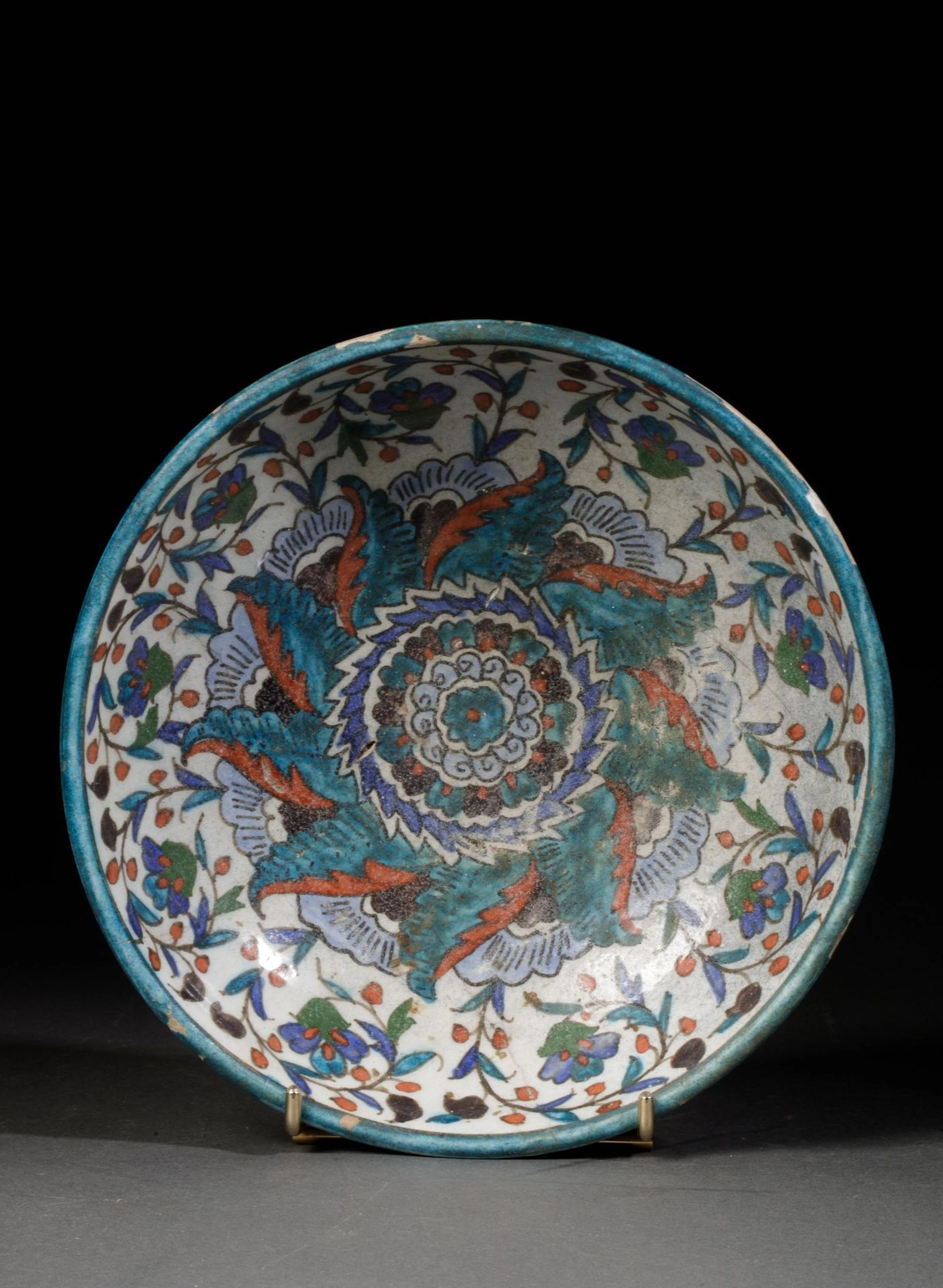 18th-century Middle Eastern piece, a polychrome glazed earth - Lot 162