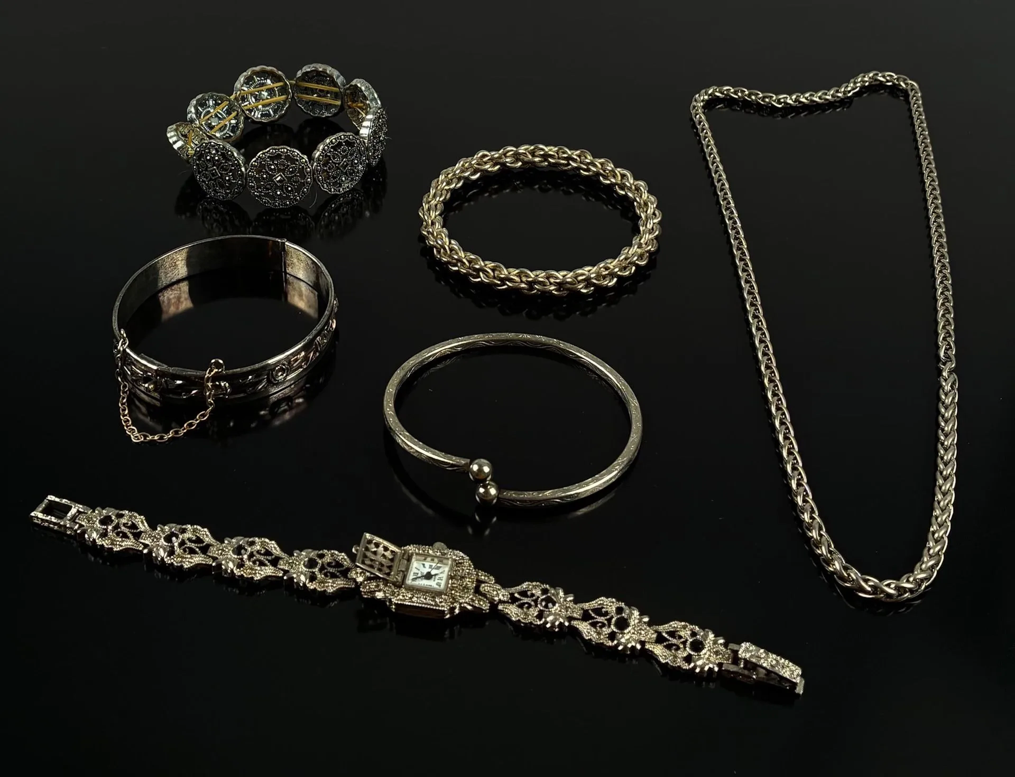 Set of four silver-plated bracelets, a watch and a chain - Lot 141