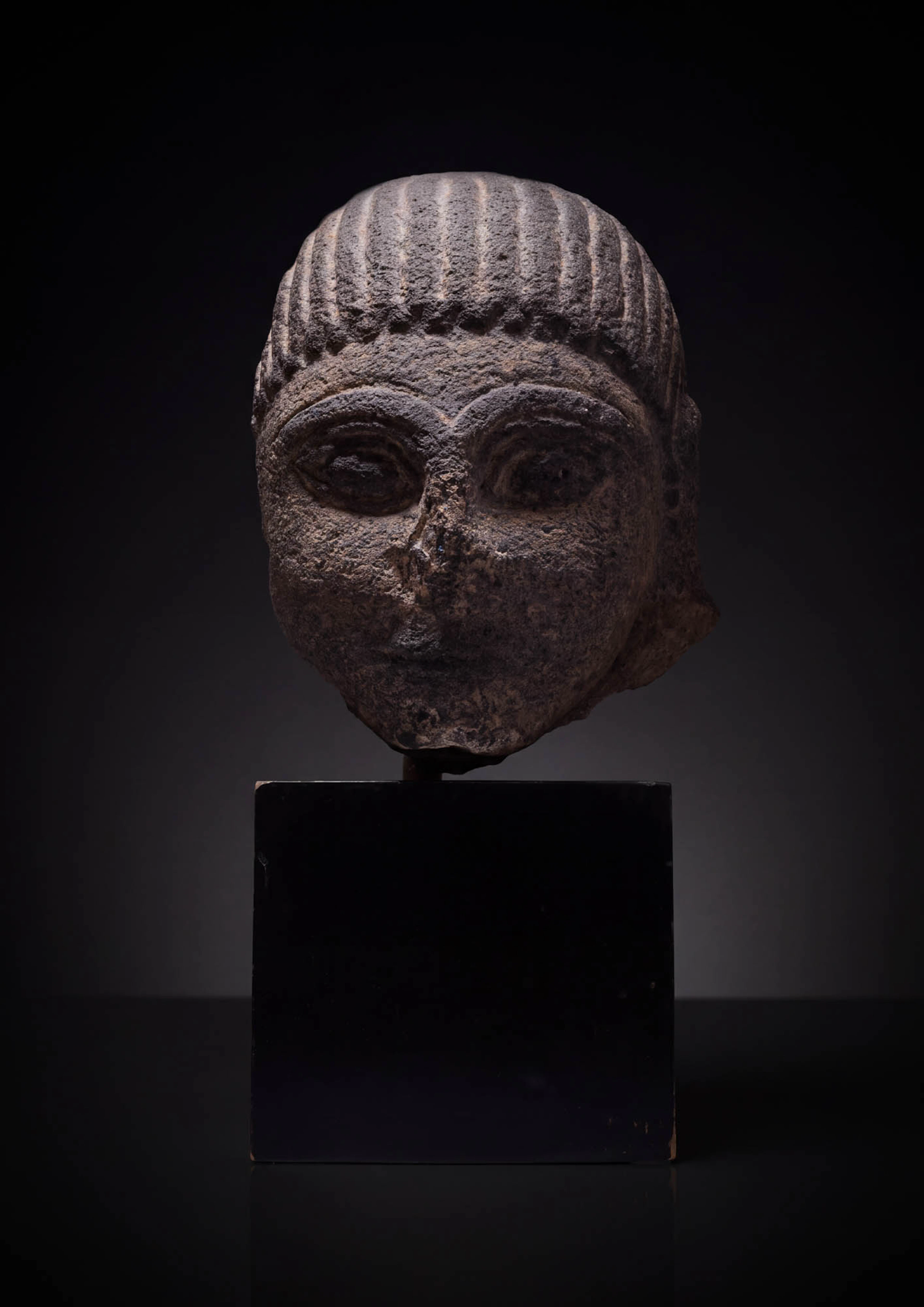 RARE ETRUSCAN NENFRO HEAD OF SPHINX