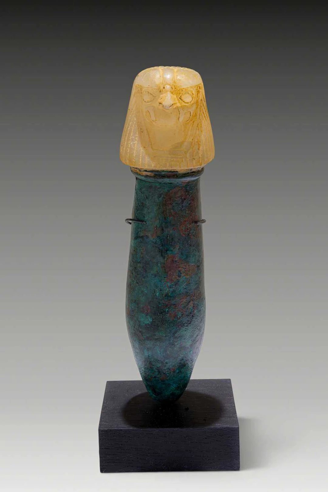 EGYPTIAN BRONZE AND ALABASTER RITUAL VESSEL WITH FALCON-SHAPED STOPPER
