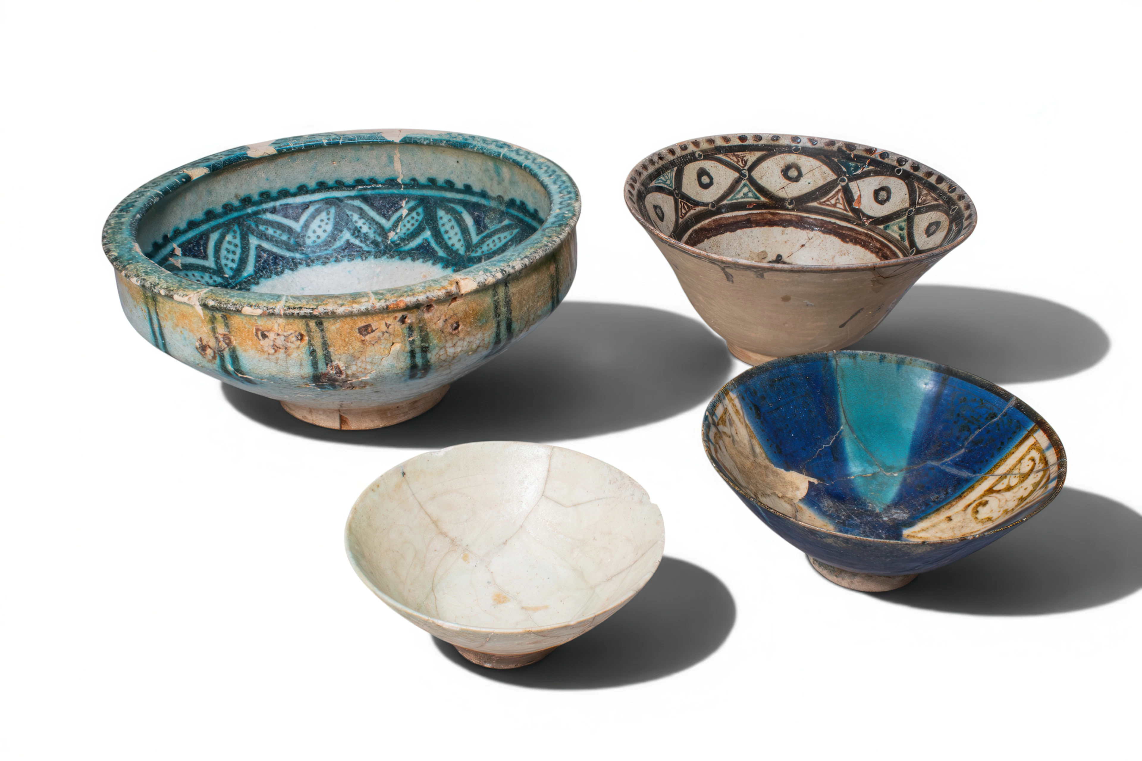 COLLECTION OF KASHAN GLAZED BOWLS WITH VEGETAL AND FLORAL DECORATION