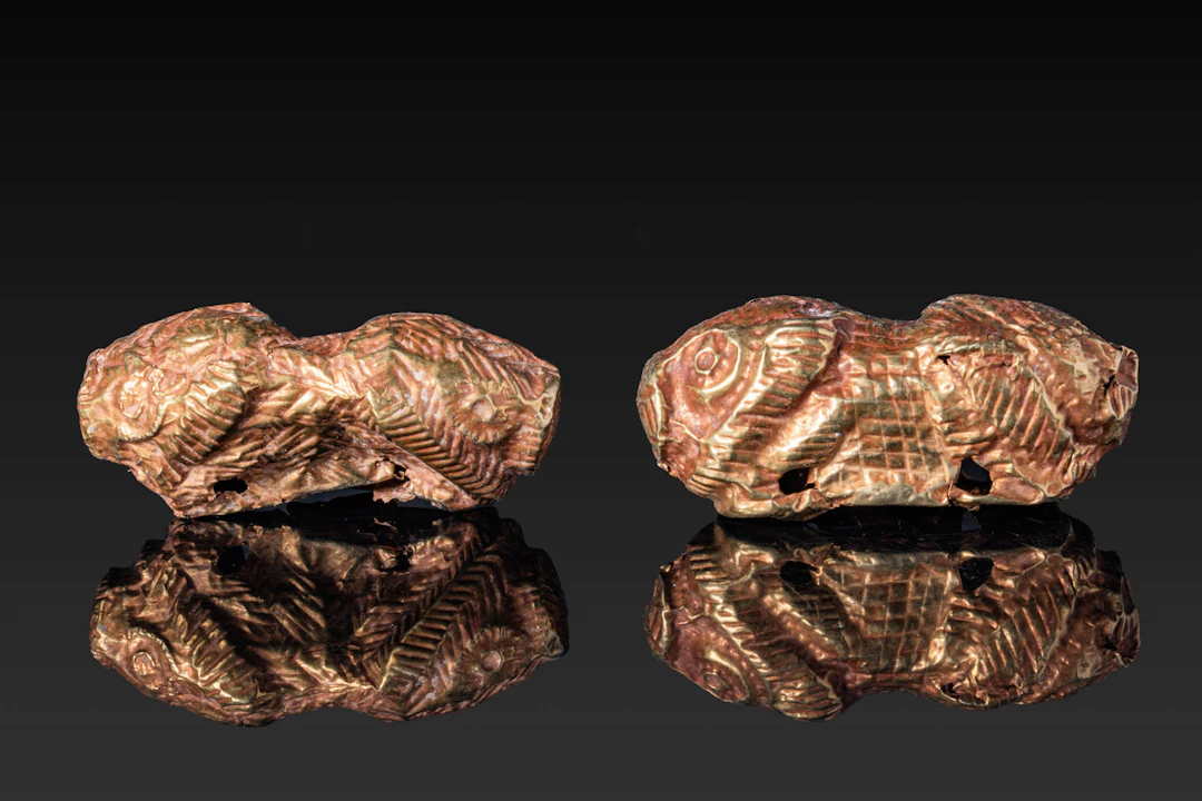 PAIR OF GREEK HIGH KARAT GOLD LION-SHAPED PENDANTS