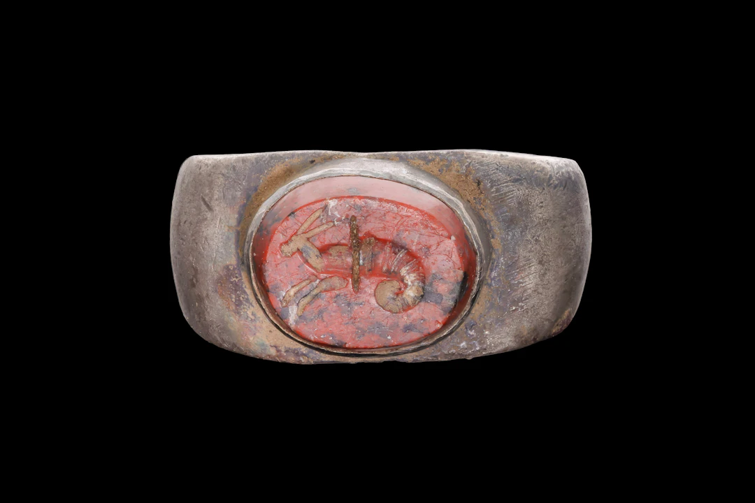 ROMAN RED JASPER INTAGLIO OF A SEA CREATURE IN SILVER RING
