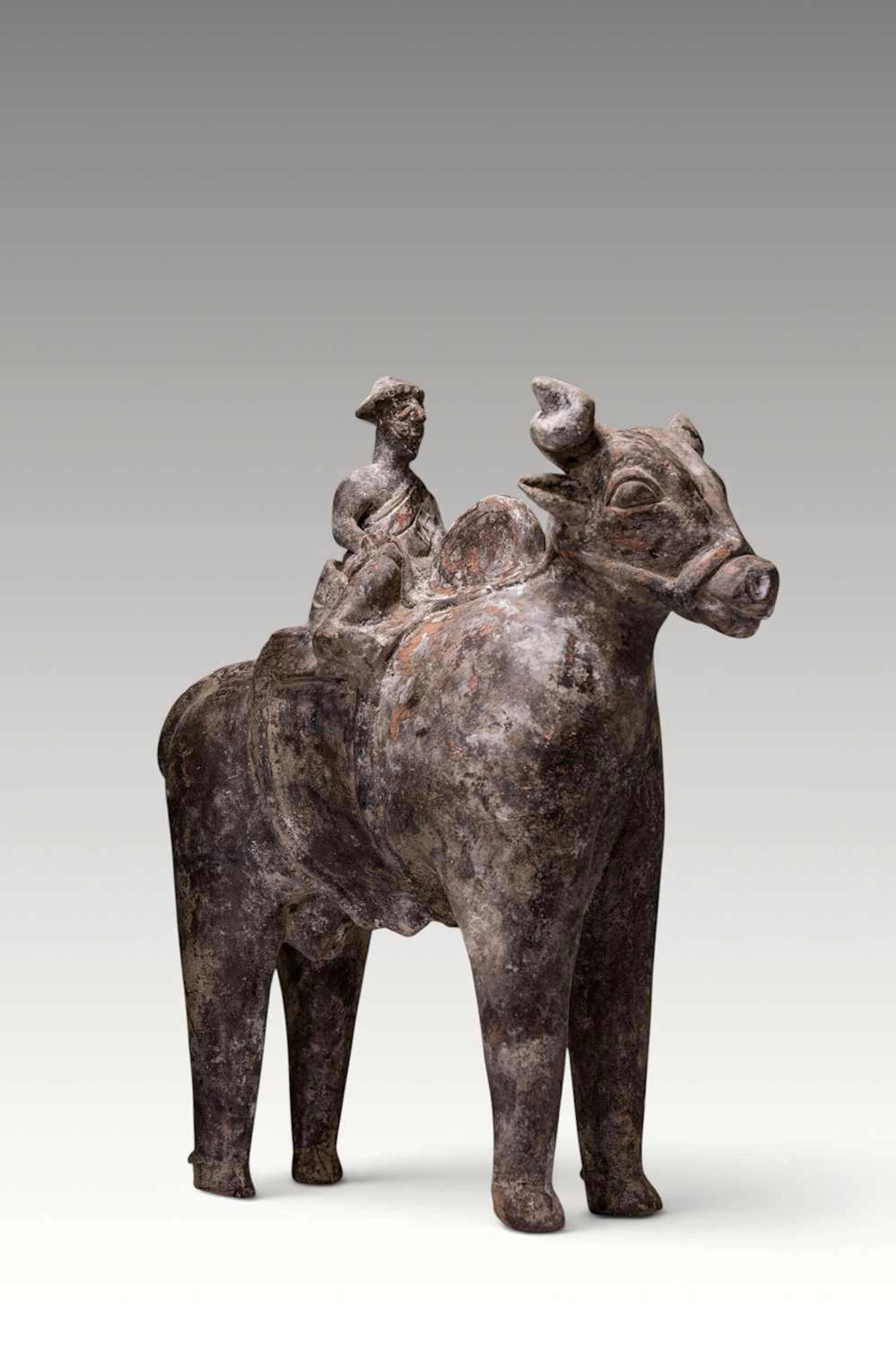 MASSIVE SOUTH ARABIAN FIGURINE OF A RIDER ON A BULL