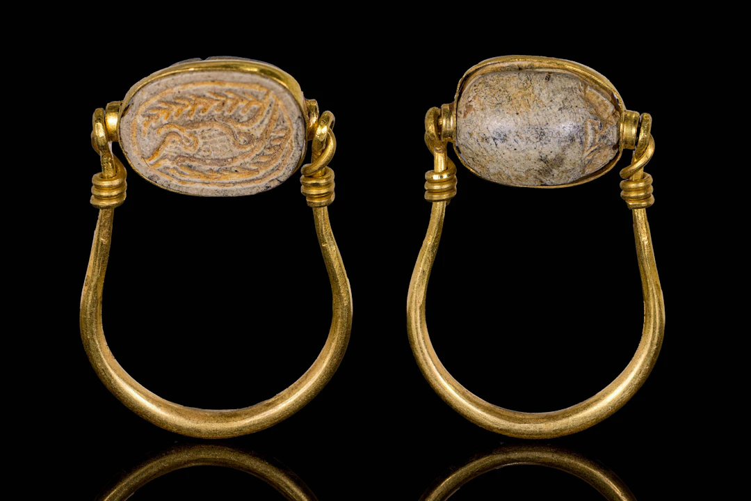 EGYPTIAN STONE SCARAB WITH PALM BRANCHES IN SWIVEL GOLD RING