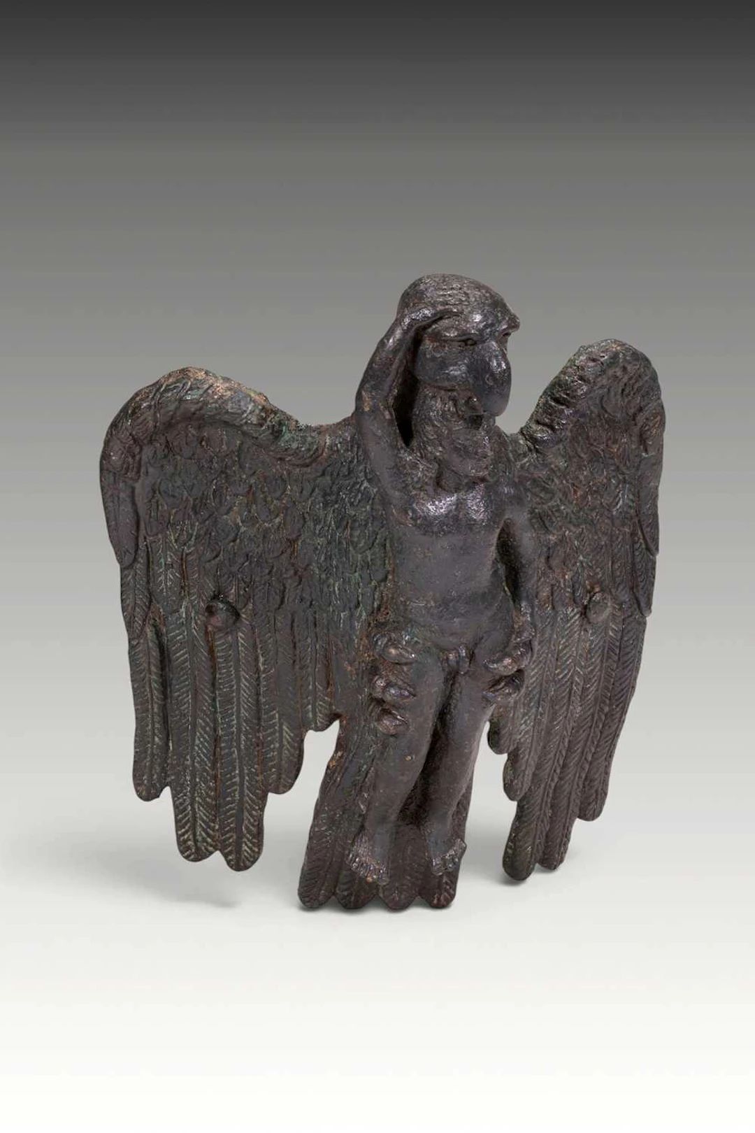HELLENISTIC BRONZE FITTING PORTRAYING THE ABDUCTION OF GANYMEDE