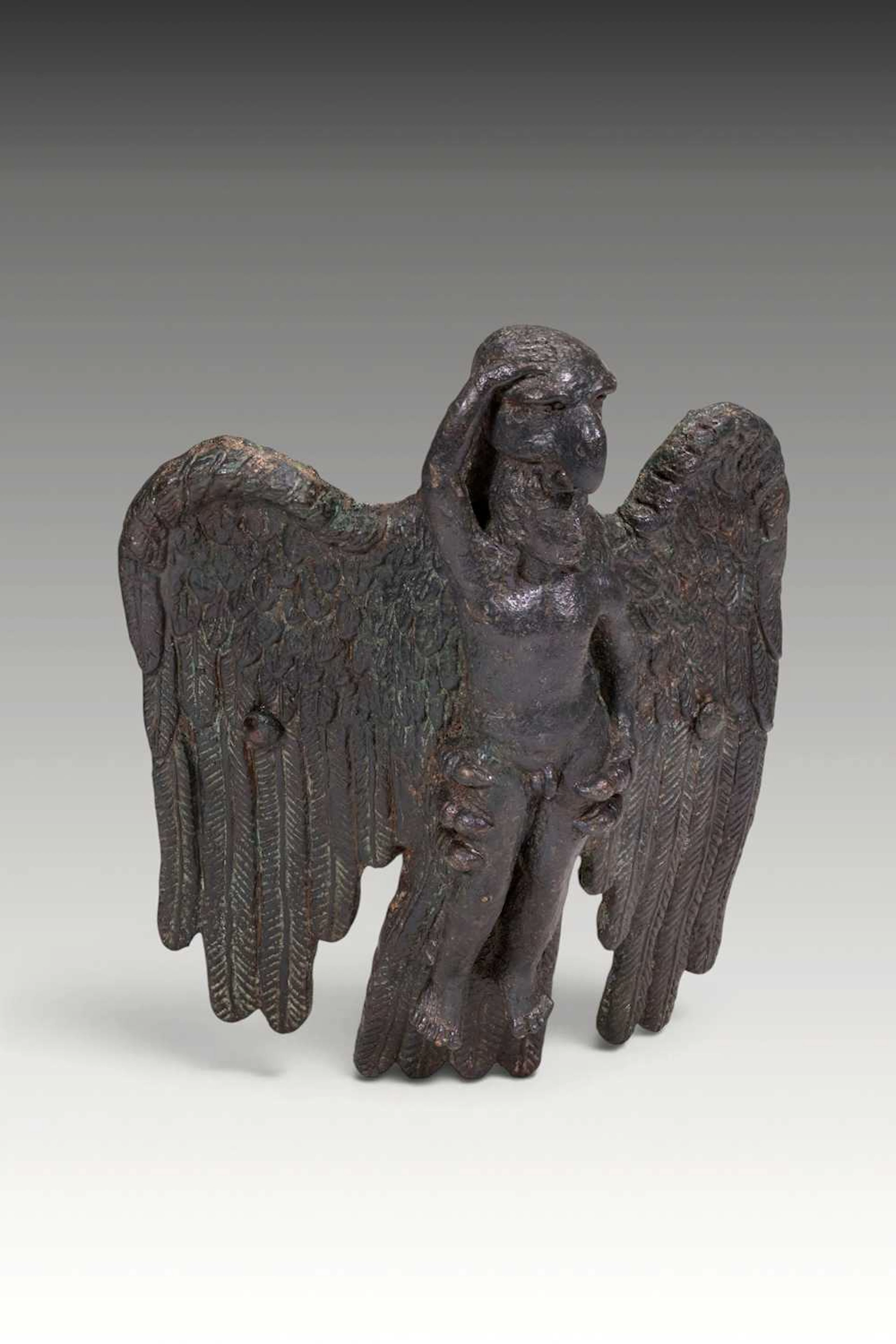 HELLENISTIC BRONZE FITTING PORTRAYING THE ABDUCTION OF GANYMEDE