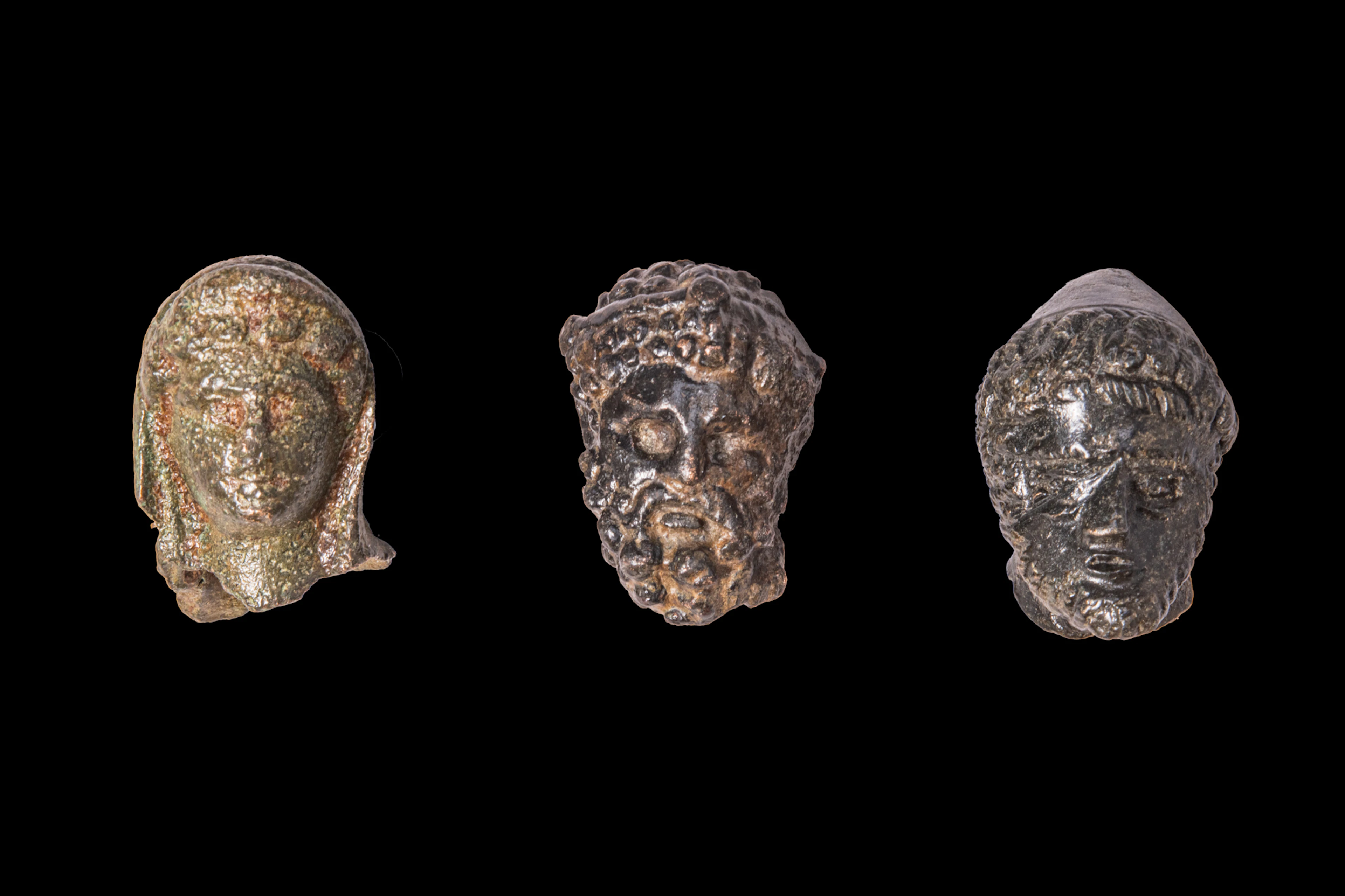 COLLECTION OF HELLENISTIC OR ROMAN BRONZE HEADS OF GODS