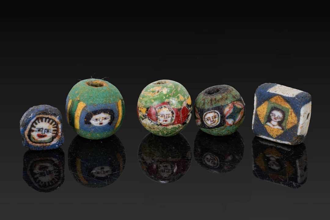 COLLECTION OF ROMAN MOSAIC GLASS BEADS WITH FACES
