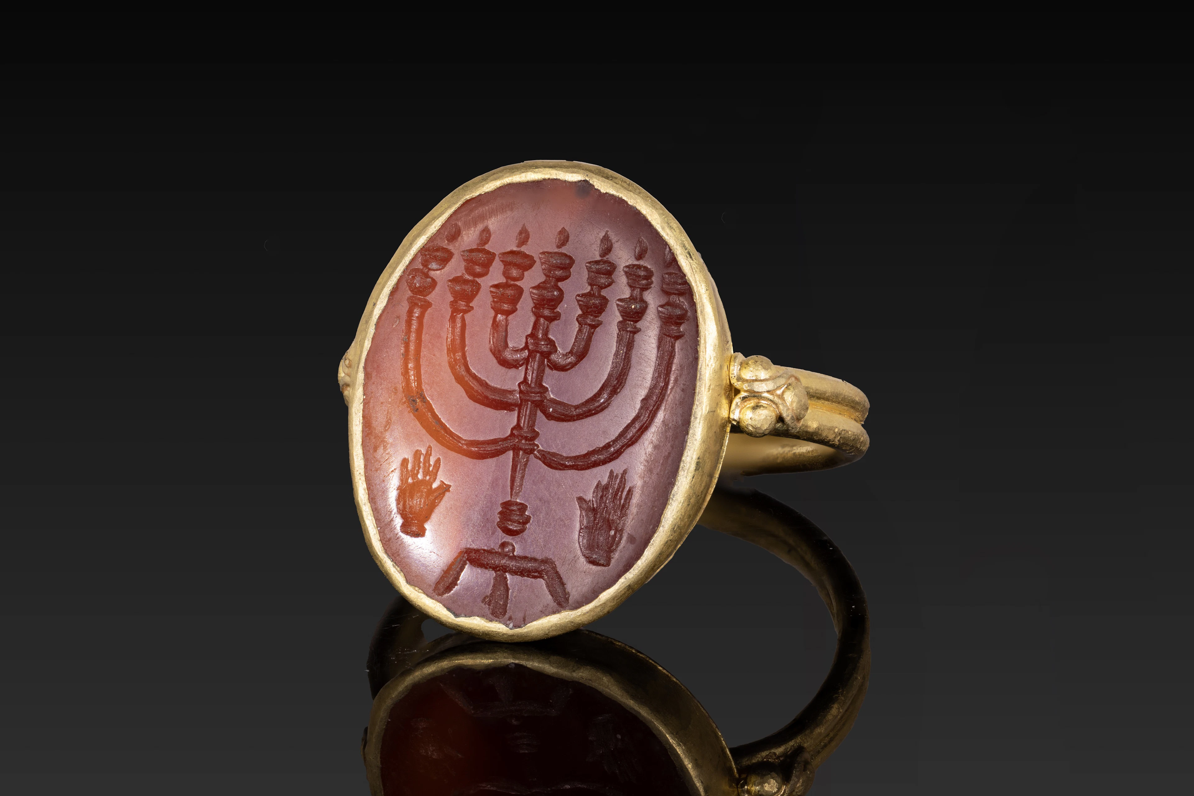 ROMANO-JEWISH CARNELIAN INTAGLIO OF MENORAH IN GOLD RING