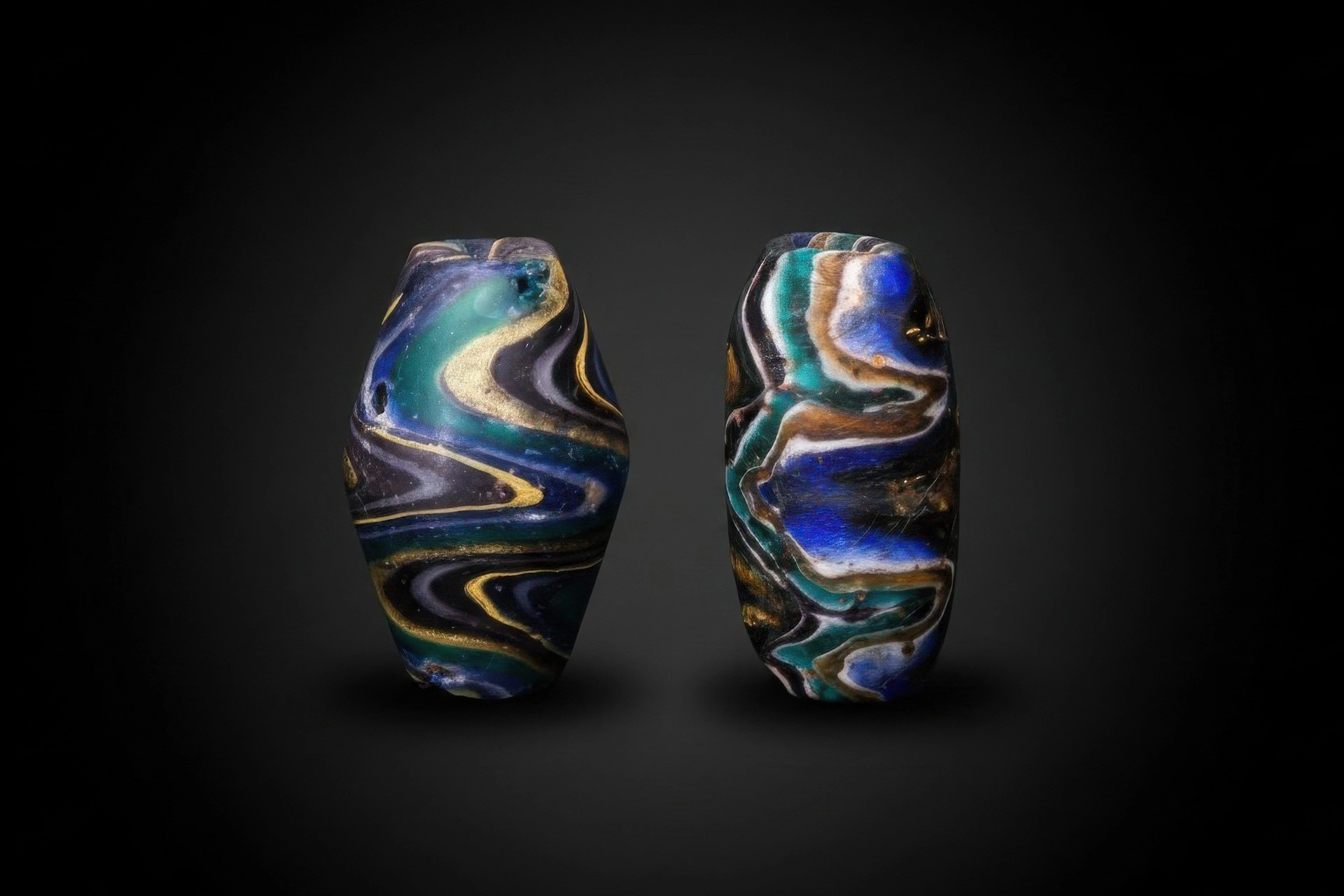 STUNNING PAIR OF ROMANO-EGYPTIAN MARBLED GLASS BEADS