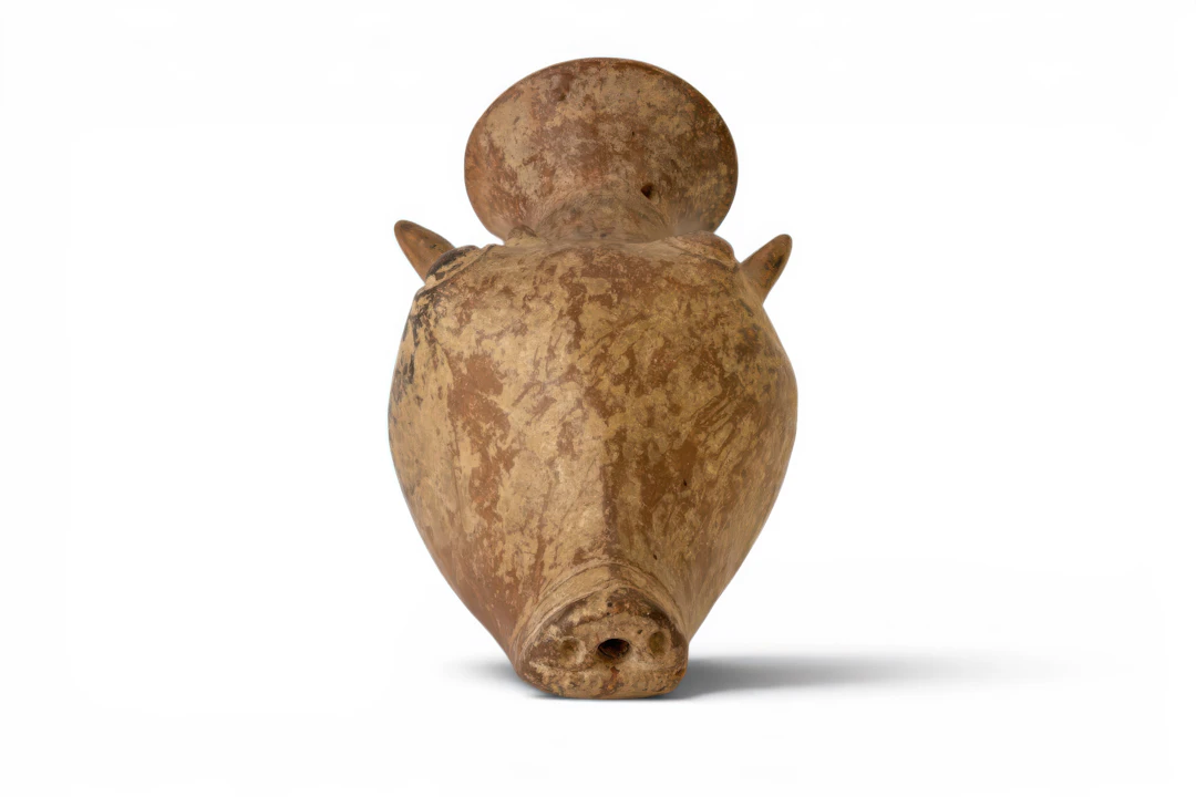 GREEK TERRACOTTA ASKOS IN THE SHAPE OF A BULL'S HEAD