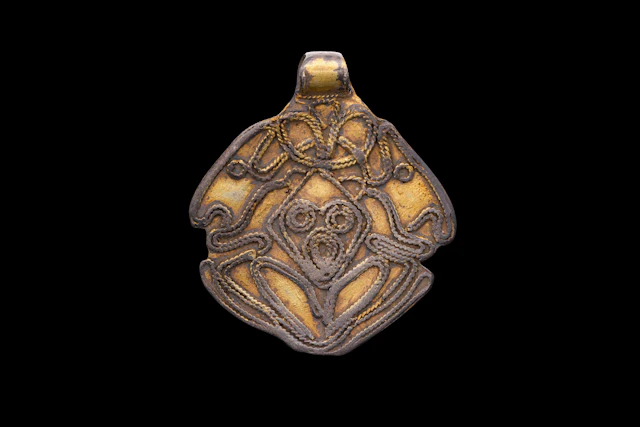 VIKING SILVER-GILT PENDANT WITH ODIN