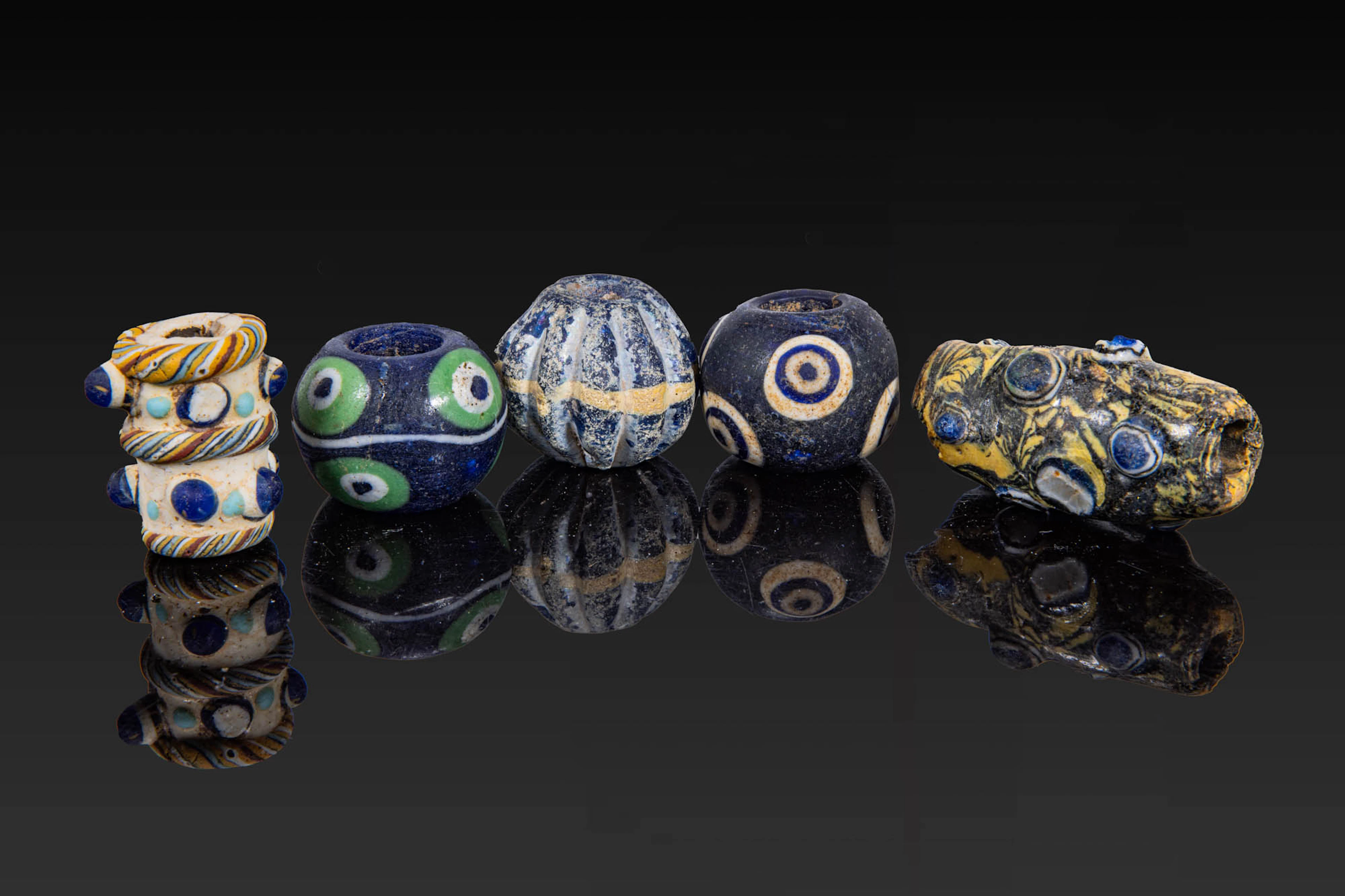 COLLECTION OF LARGE PHOENICIAN POLYCHROME GLASS BEADS