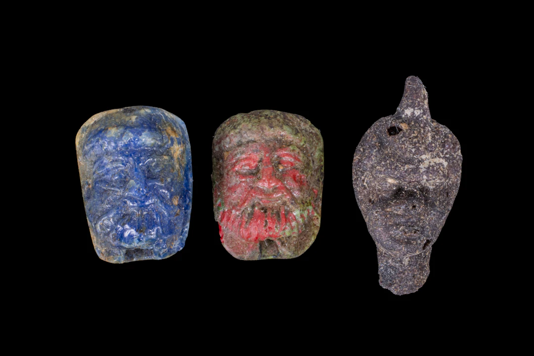 COLLECTION OF RARE ROMAN GLASS FACE BEADS