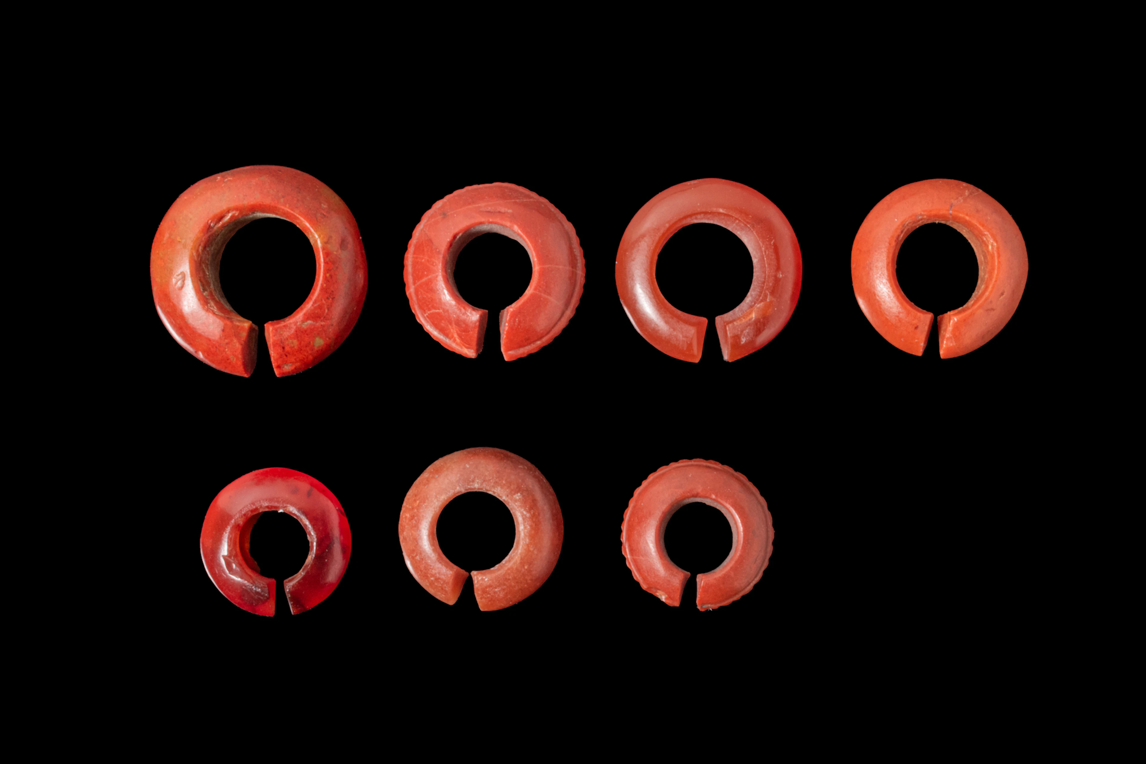COLLECTION OF EGYPTIAN JASPER AND CARNELIAN EARRINGS OR HAIR RINGS