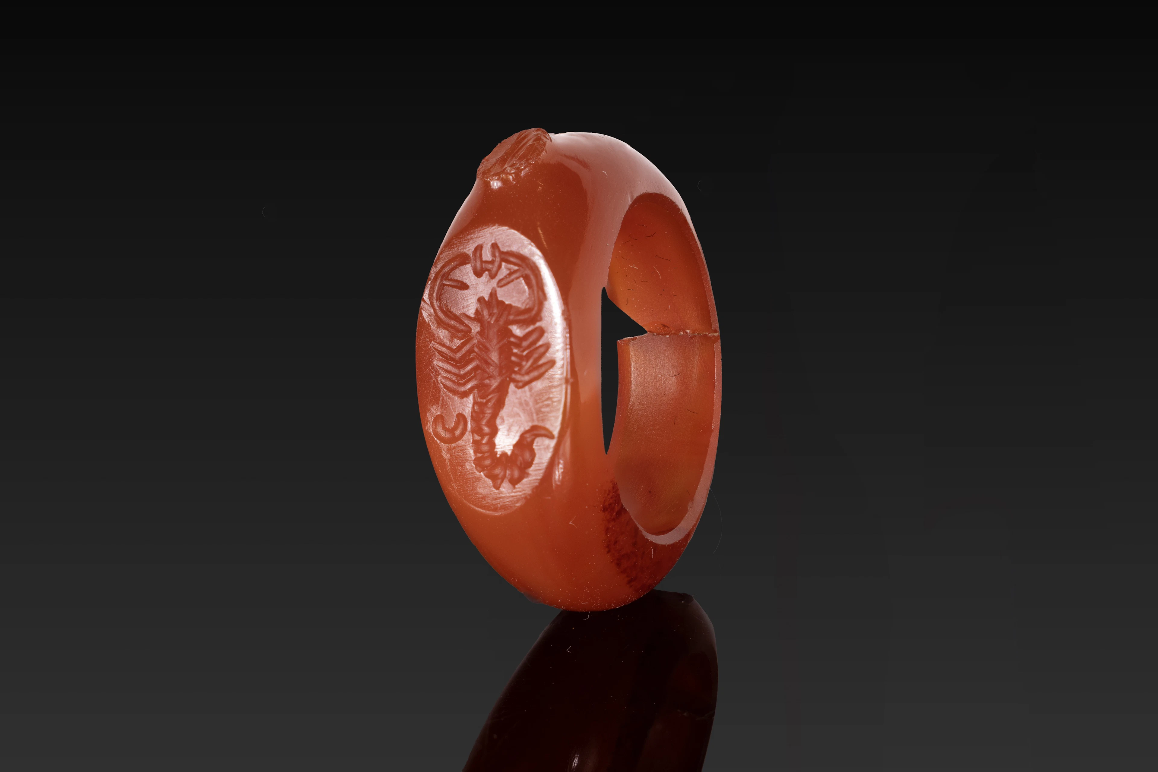EGYPTIAN CARNELIAN RING WITH SCORPION AND CRESCENT